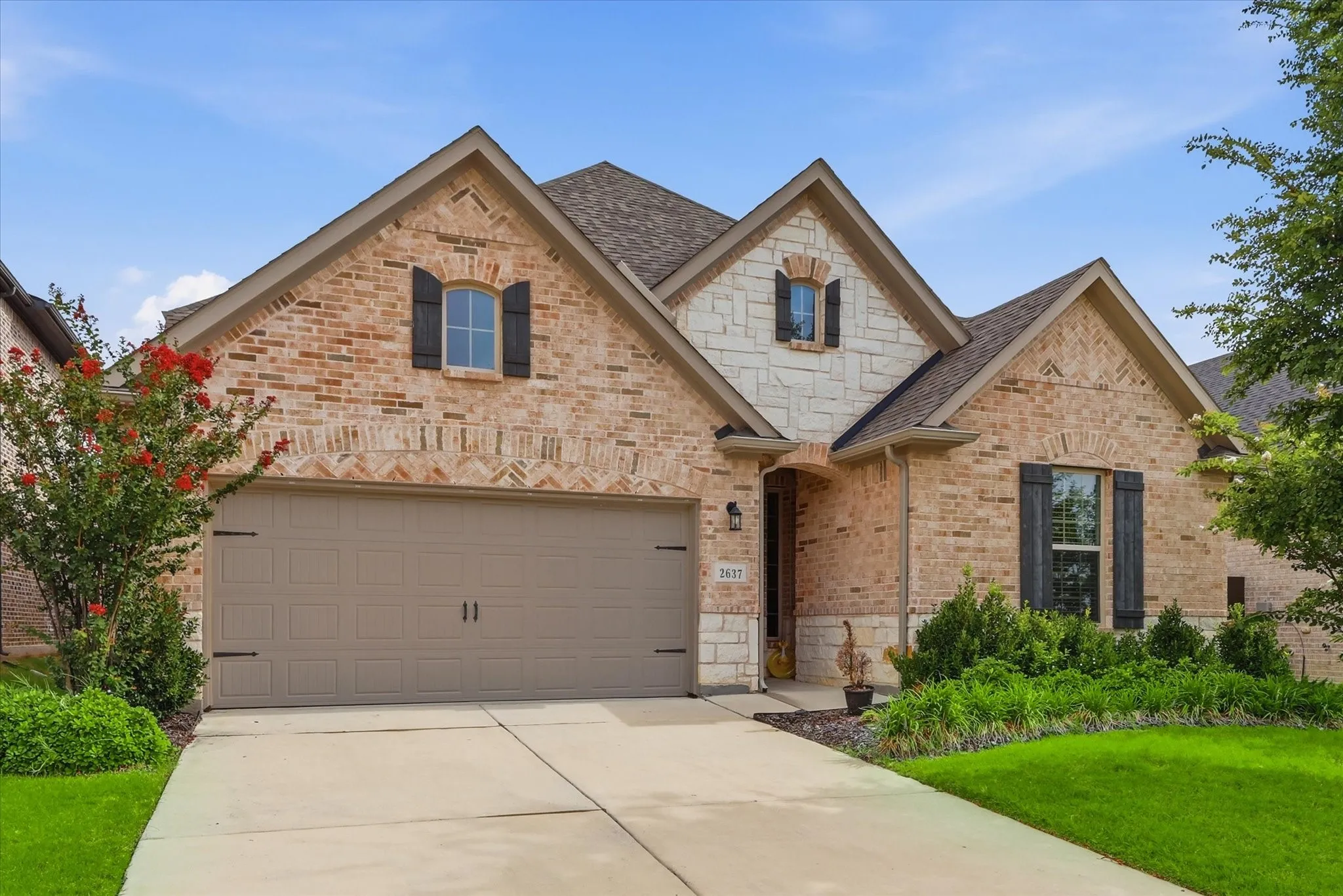 Brick and stone exterior with gabled roof lines