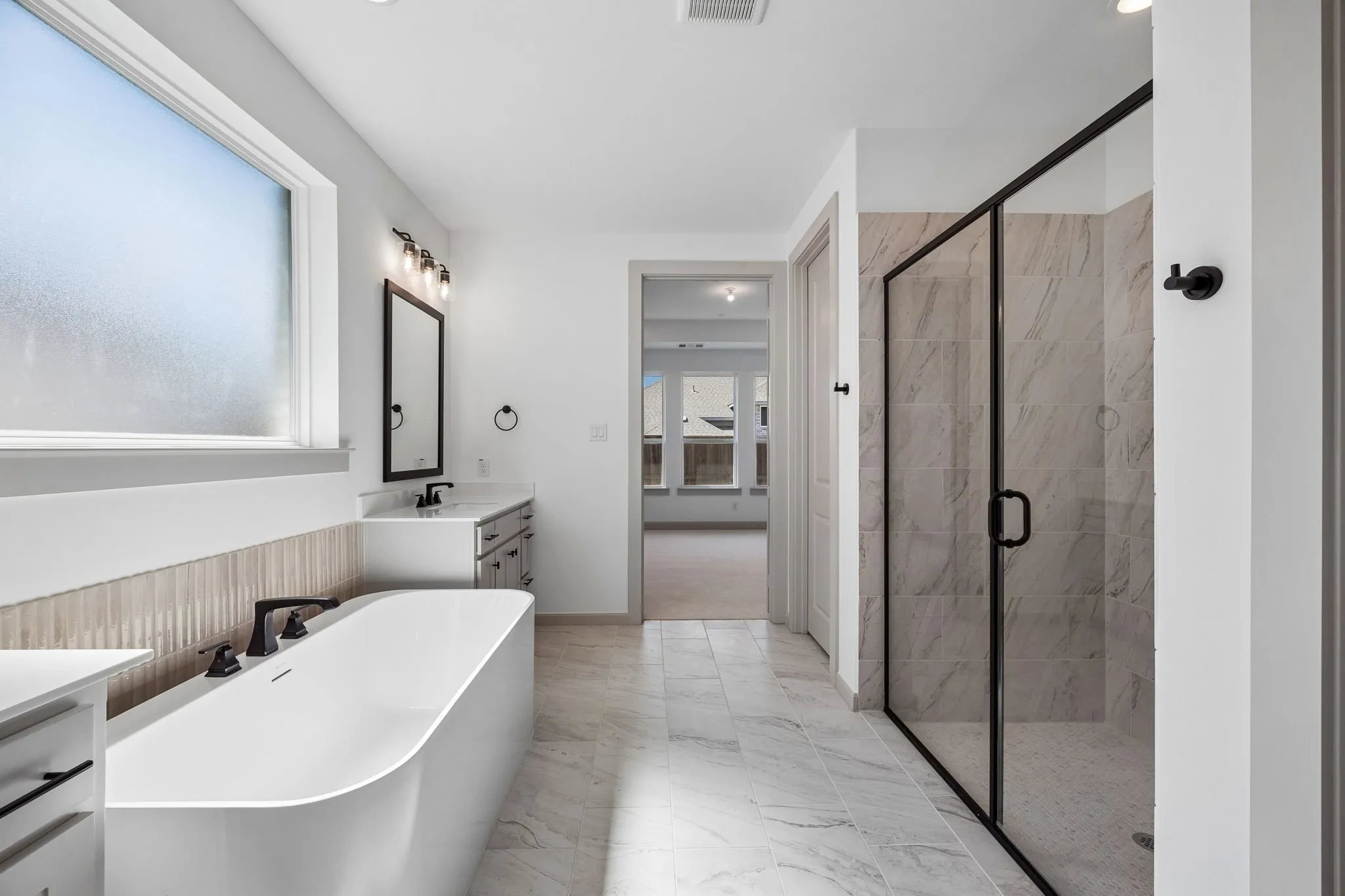 Whether it's soaking your cares away or indulging in a long, luxurious shower, this owner's bath is a dream come true!