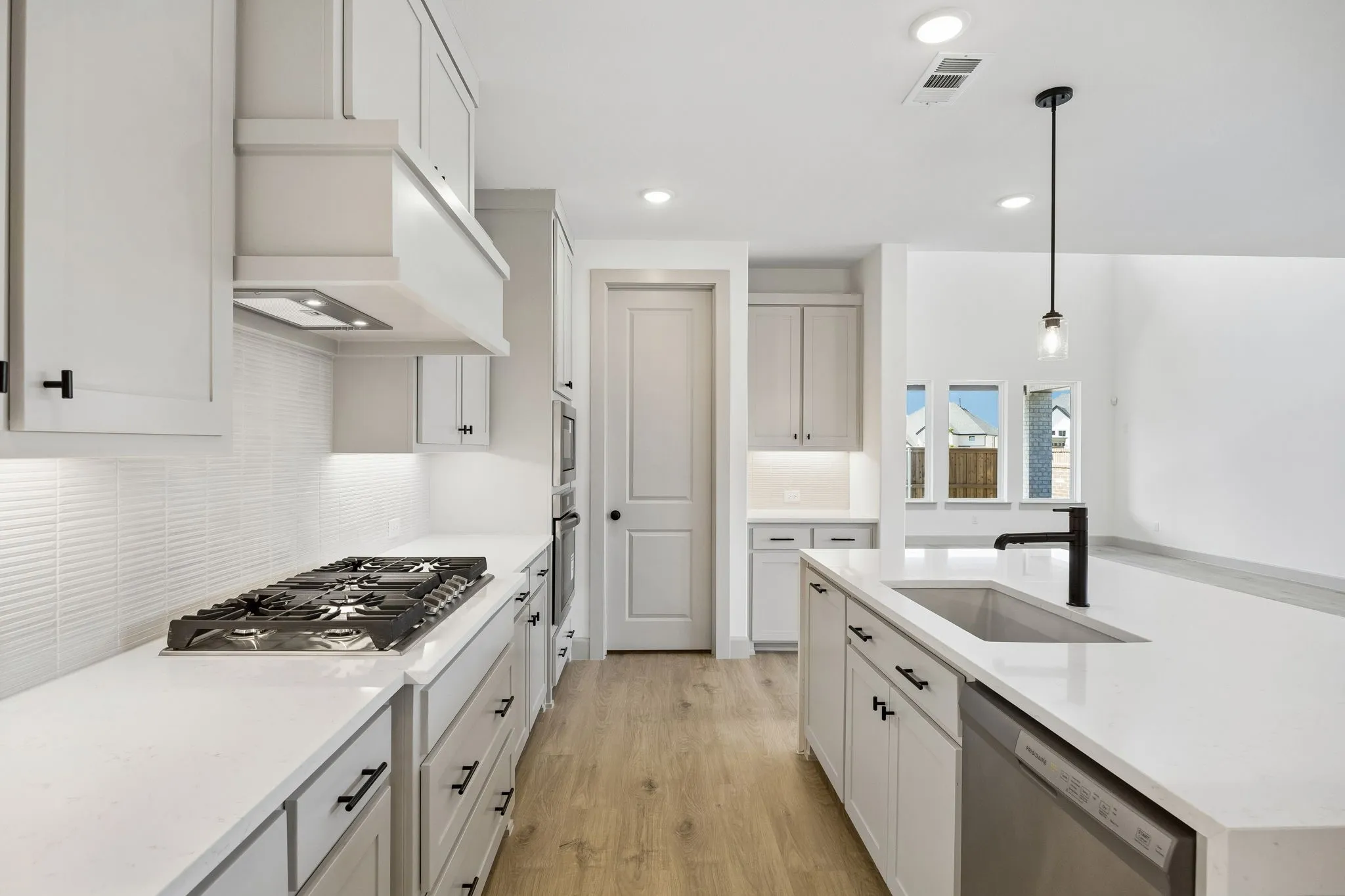 Gorgeous cabinetry, beautiful counter tops and contemporary stainless steel come together to create a chefs dream kitchen!
