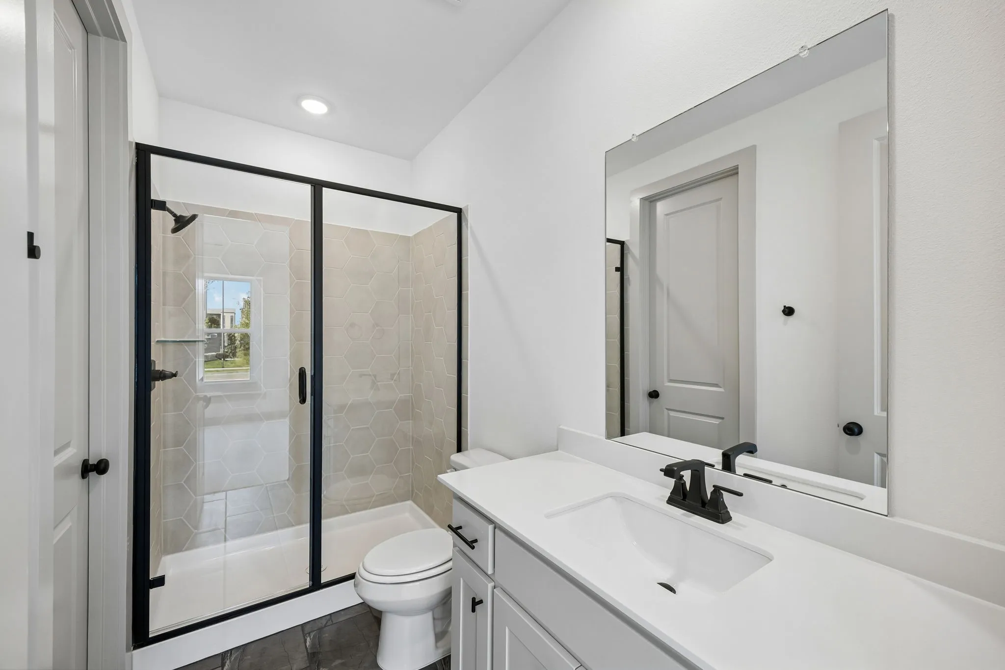 Friends and family will feel right at home in any of the beautifully finished guest baths in our Tristan plan.