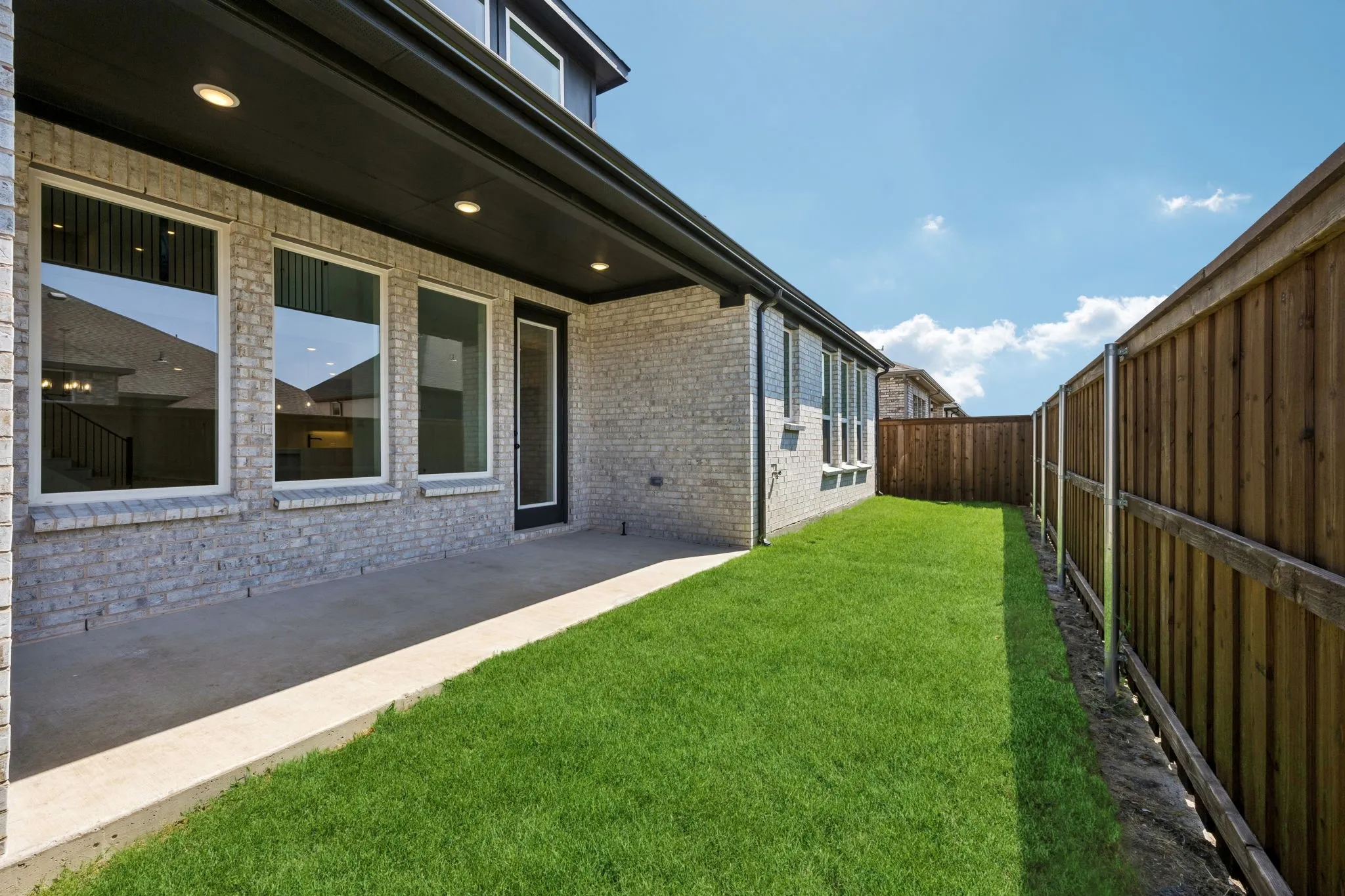 Dining al fresco is in your future on this lovely covered back patio!