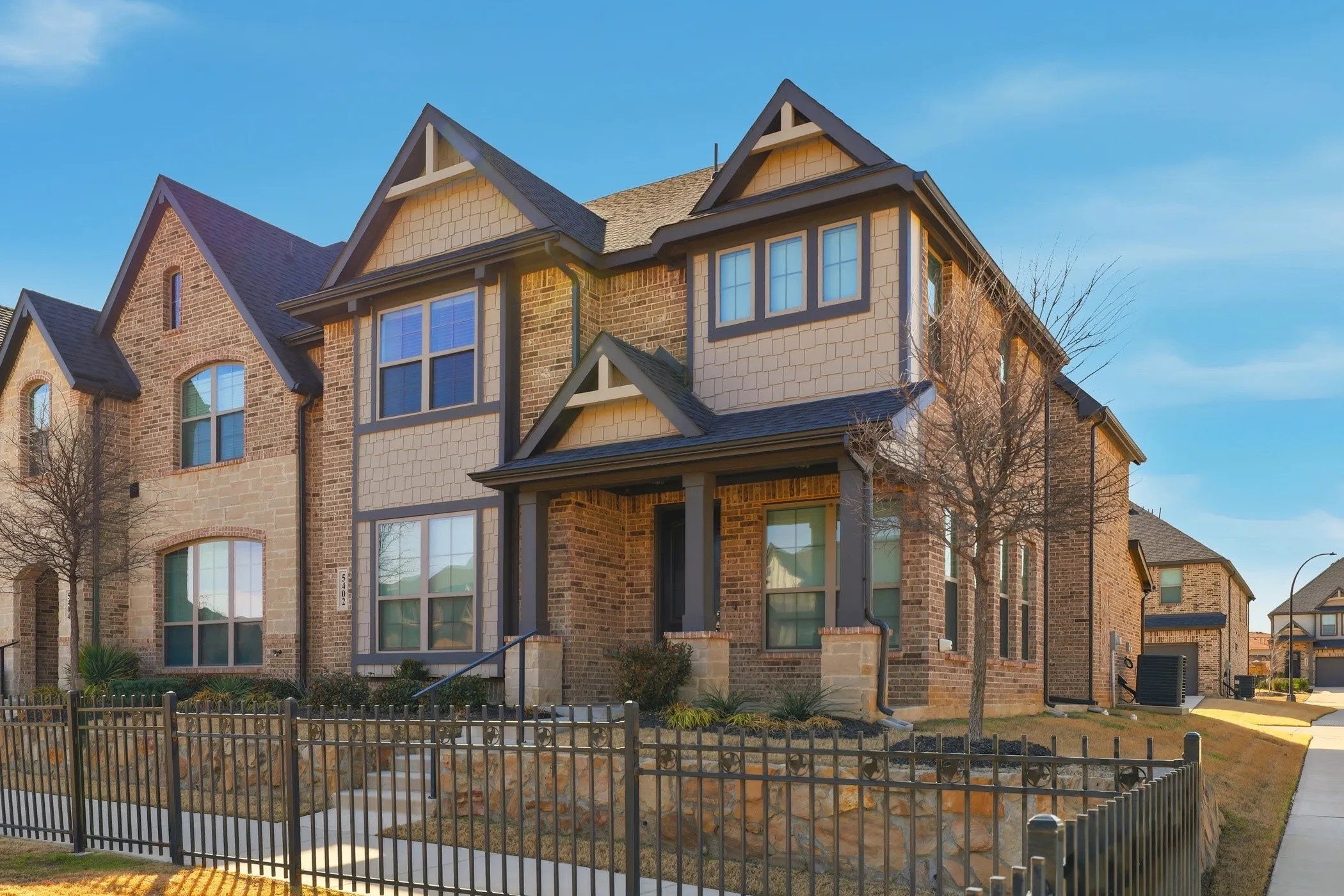 Brick and siding exterior with gabled roof lines