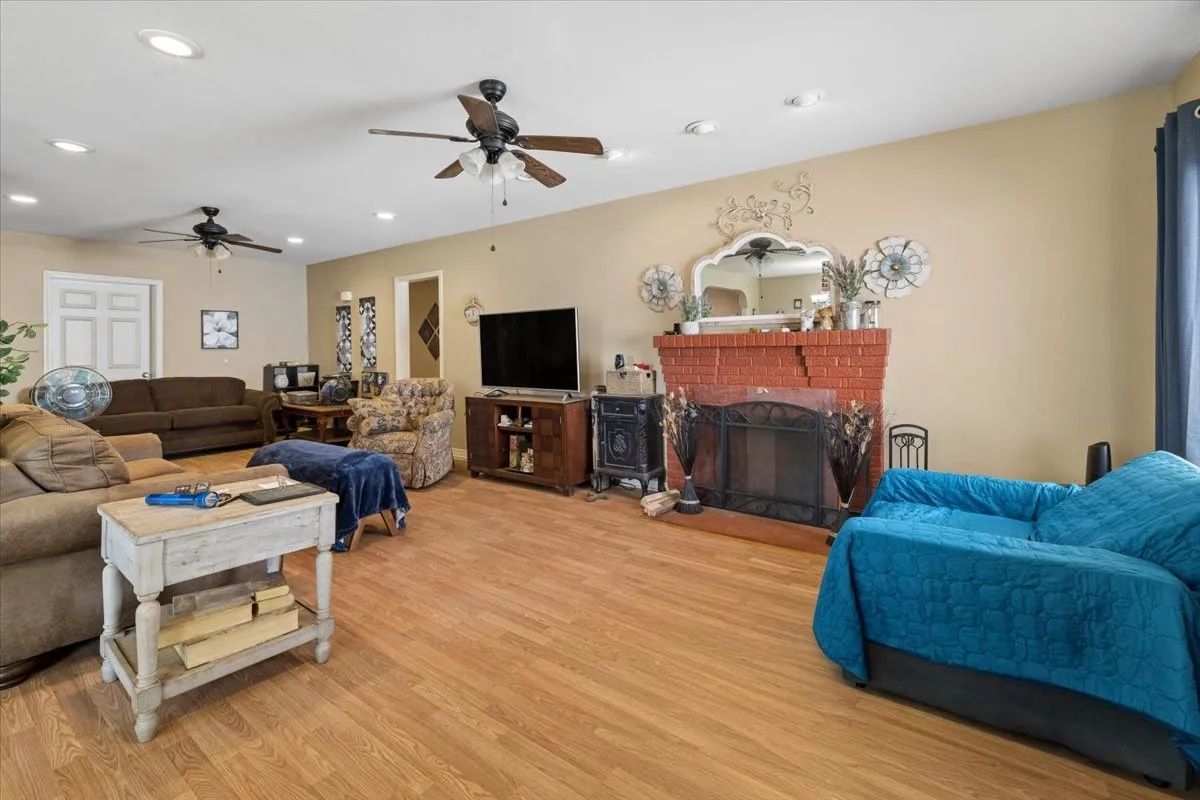 Cozy, light-filled living room offering plenty of space for comfortable seating and media setups.
