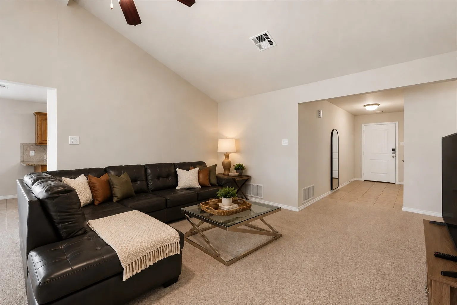 Vaulted ceiling with a ceiling fan, plush carpet flooring, recessed lighting, and a paneled front door