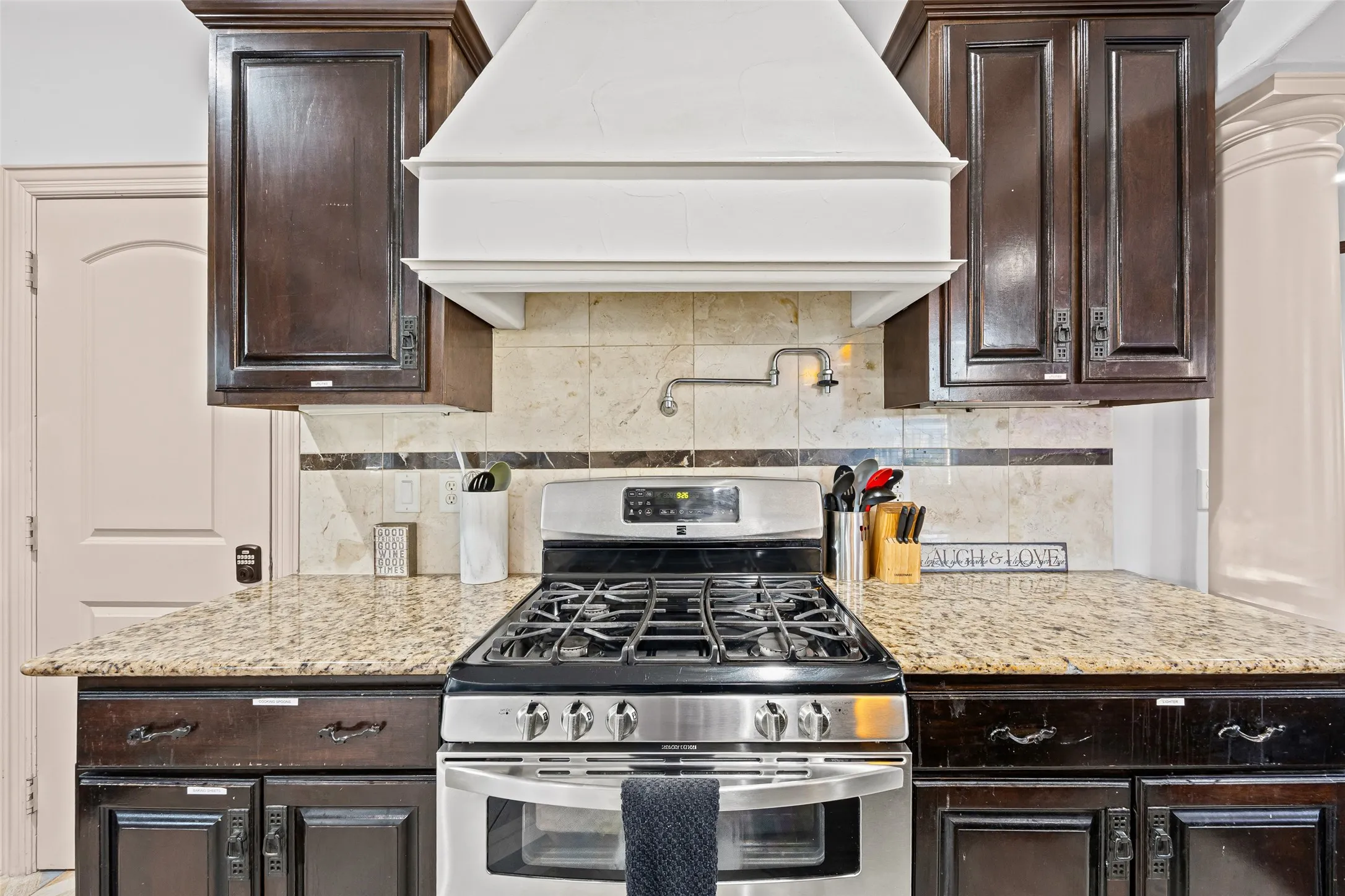 Kitchen on level 2 with gas stove, double oven and pot filler
