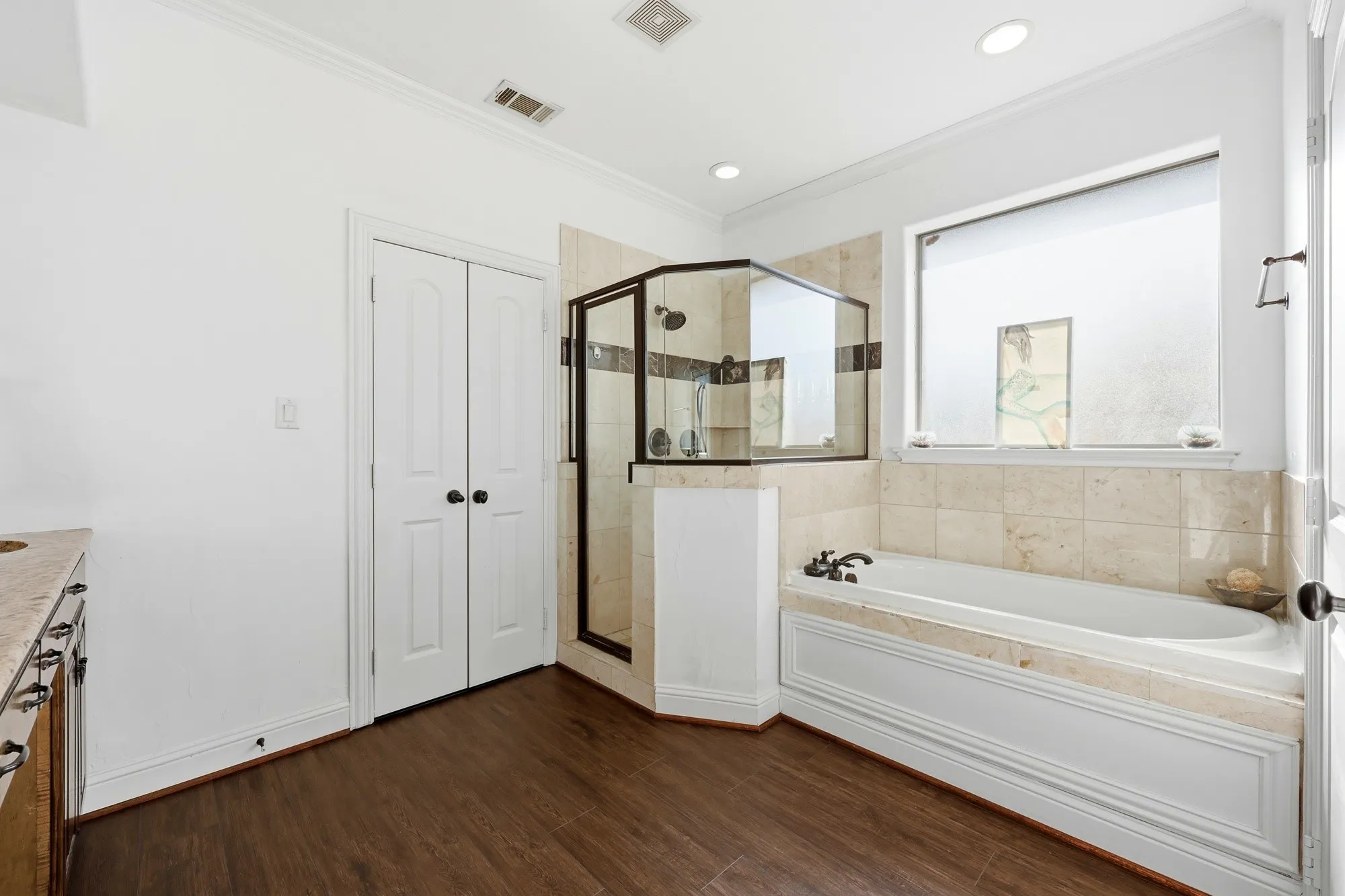 Primary bathroom #1 with separate shower and garden tub on level 3