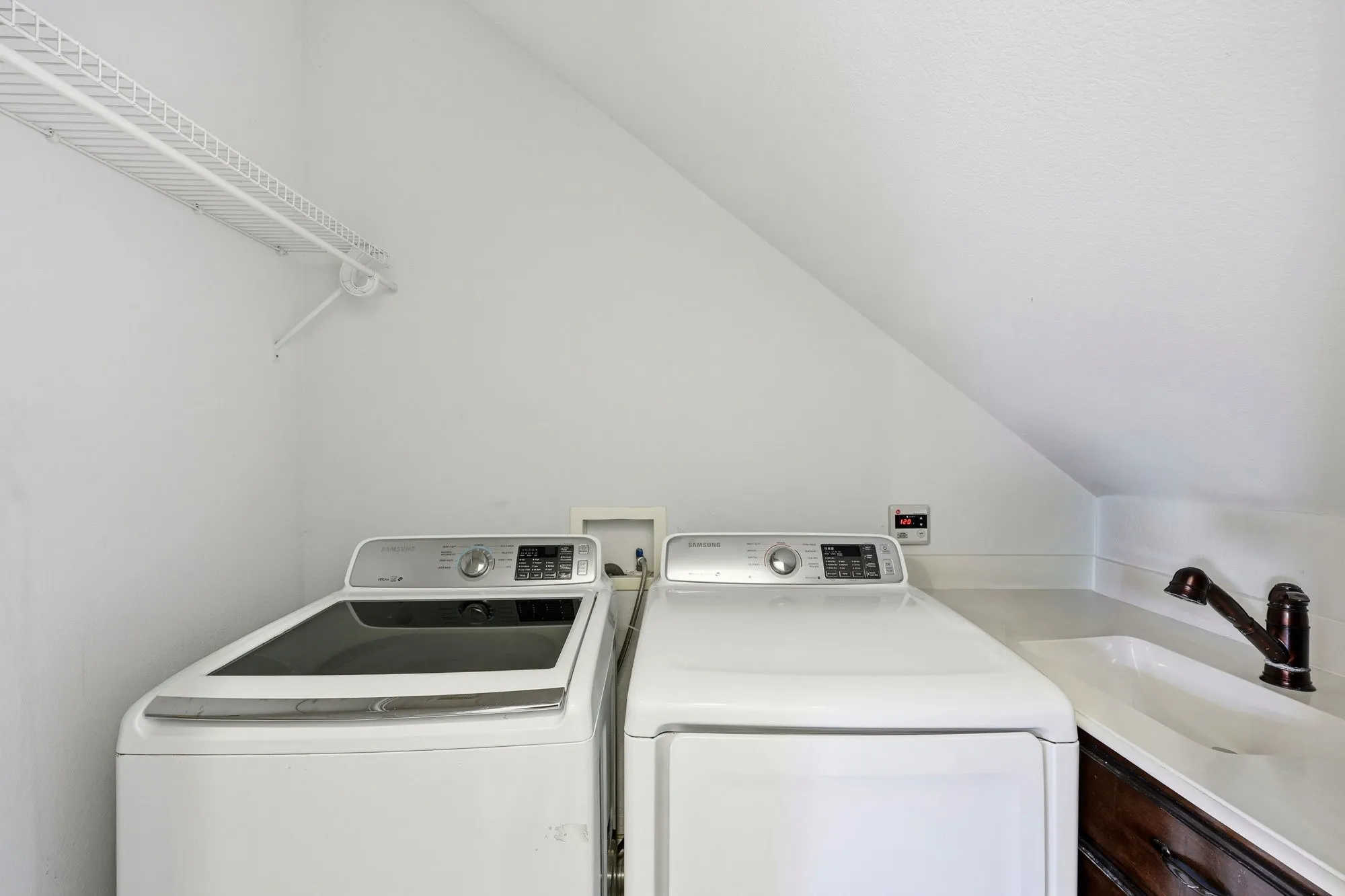 Full size laundry room with sink on level 1