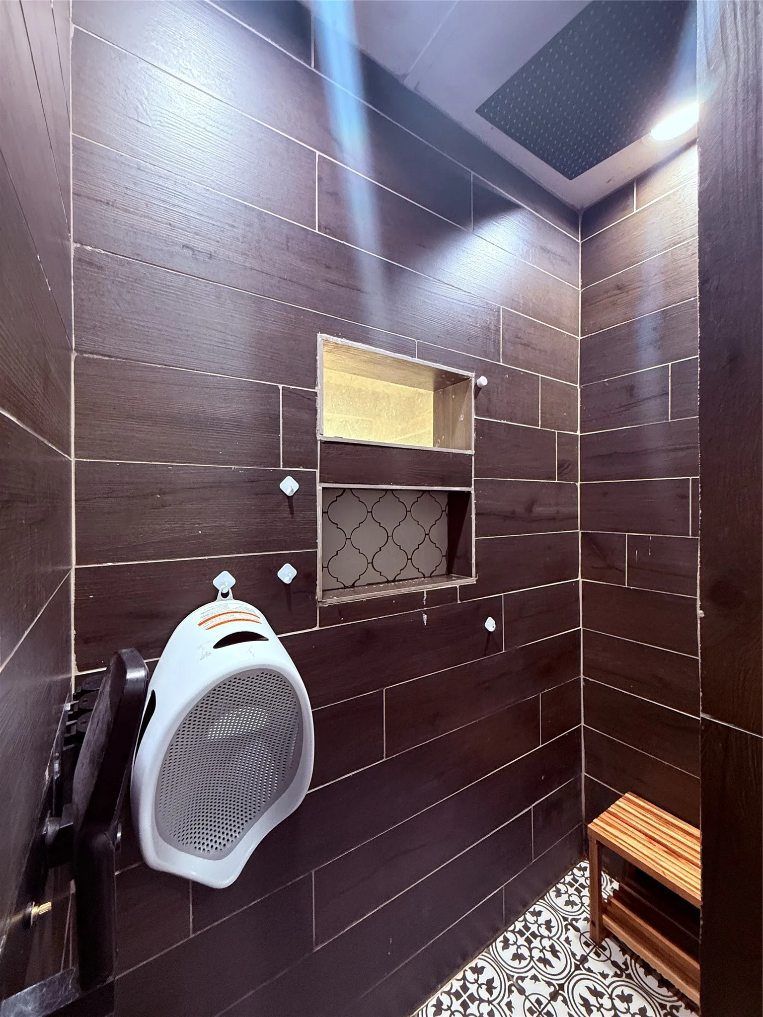Dark wood-finish tile walls with built-in shelving