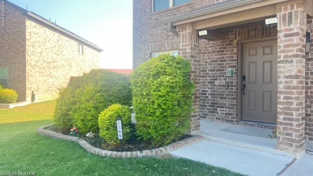 Brick exterior with a covered entry