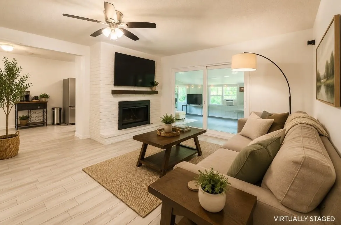 White brick fireplace with a dark wood-finish mantel