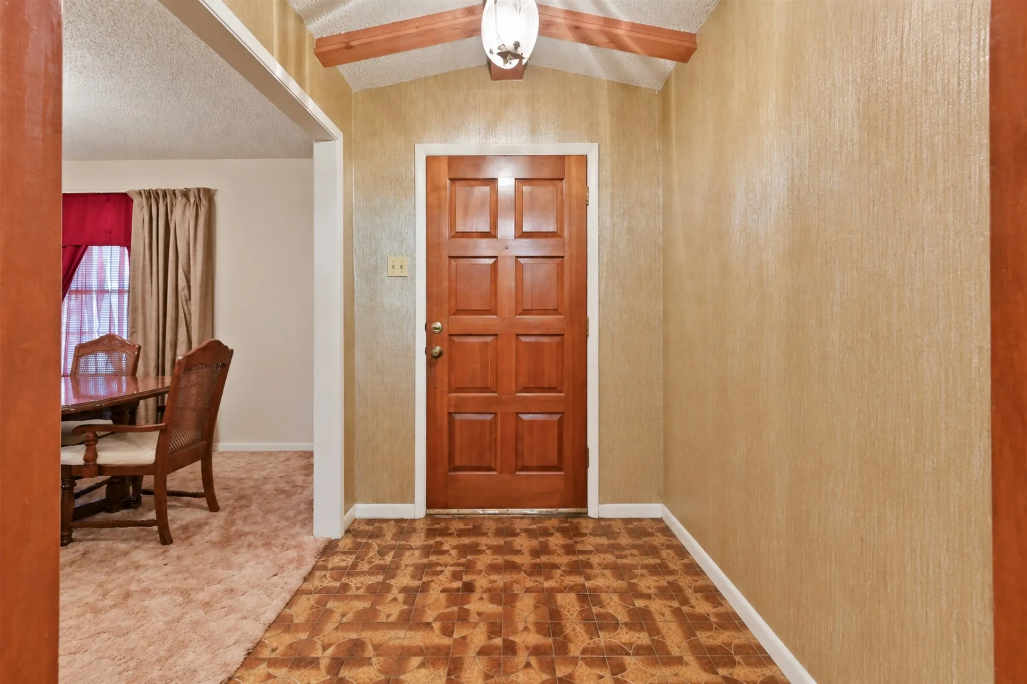 Wood panel front entry door with decorative hardware