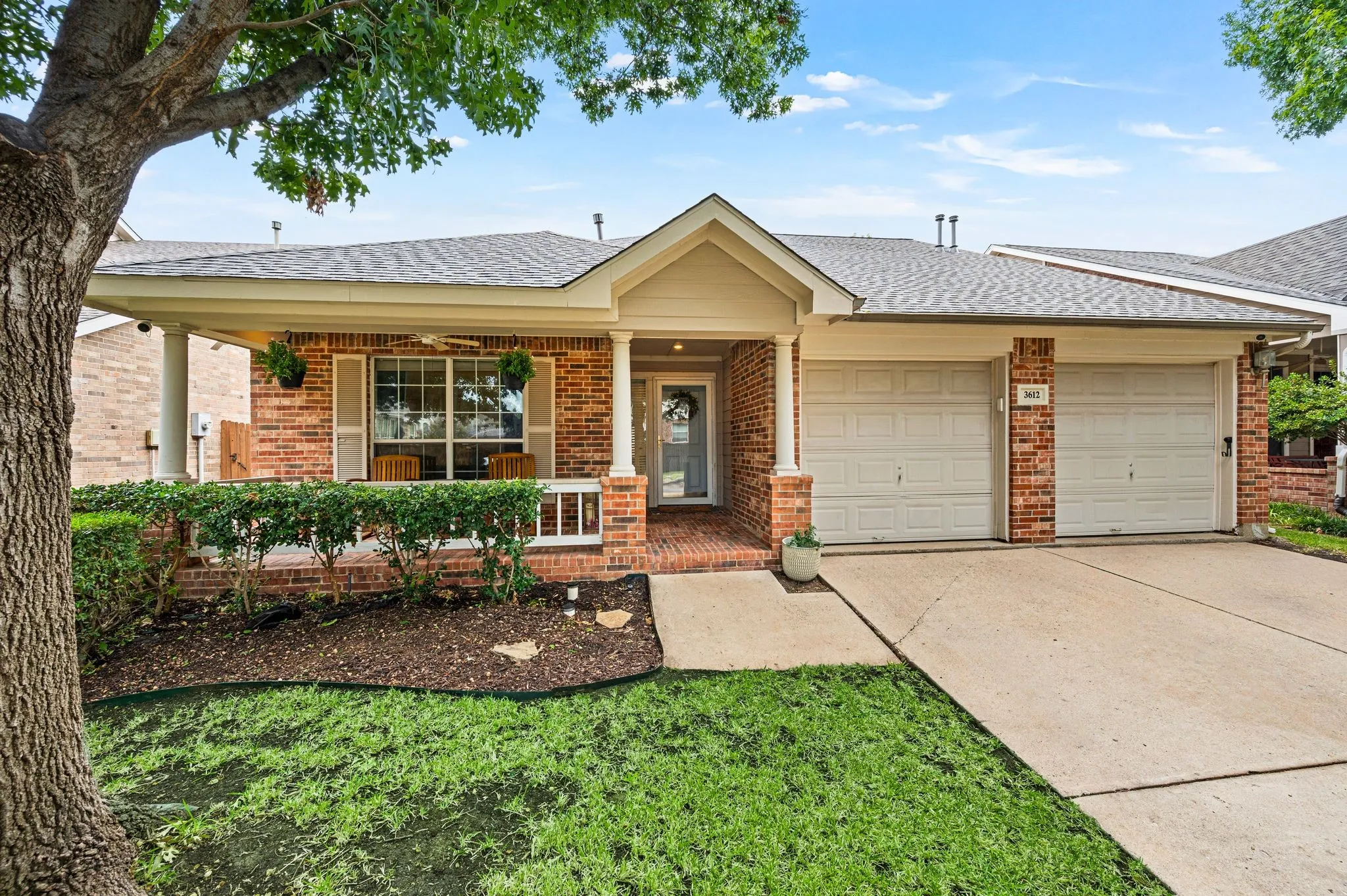 Brick exterior with a covered porch