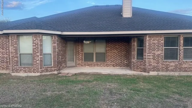 Brick exterior with an asphalt shingle roof