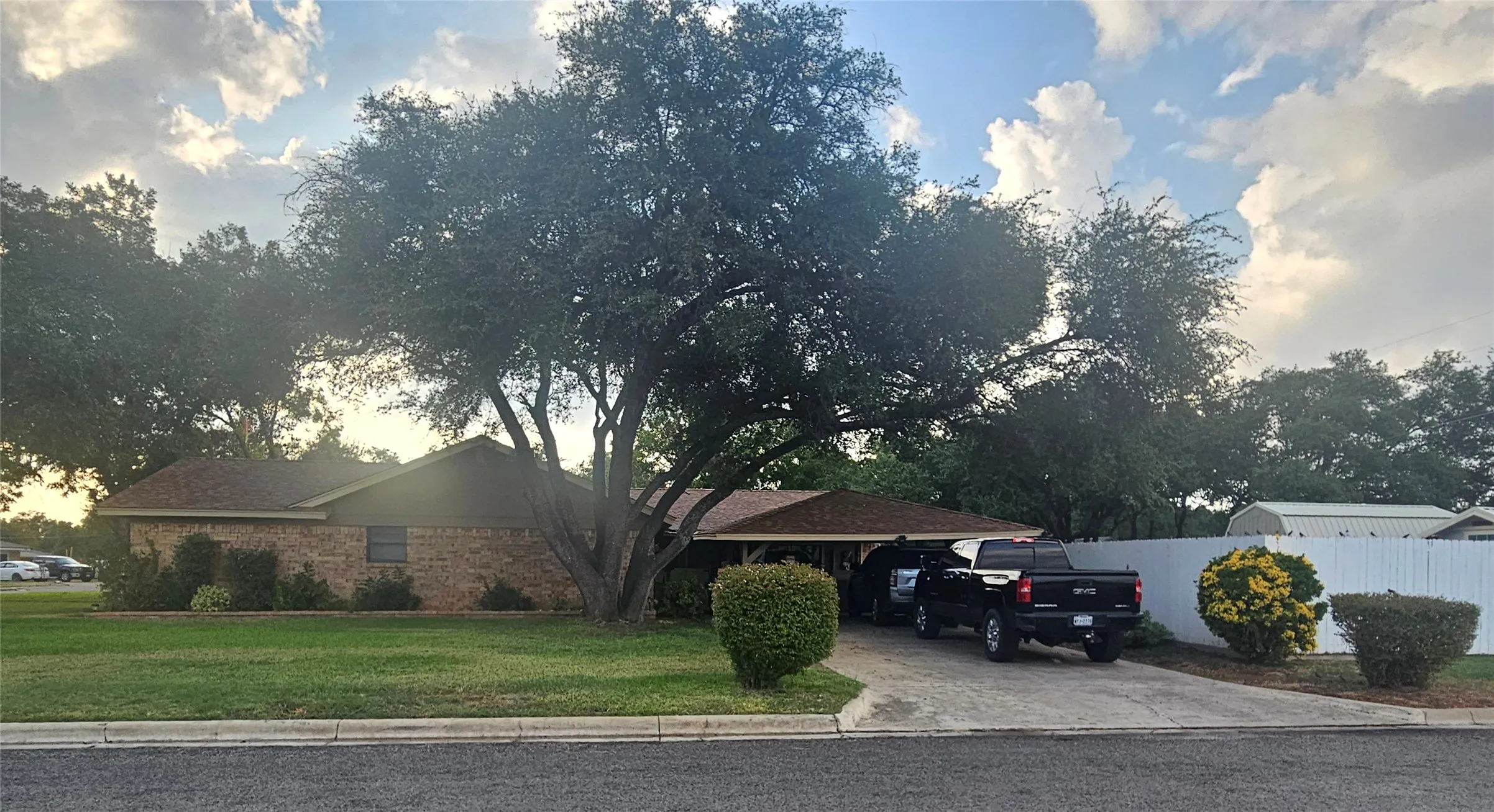 Covered parking on the side of the house