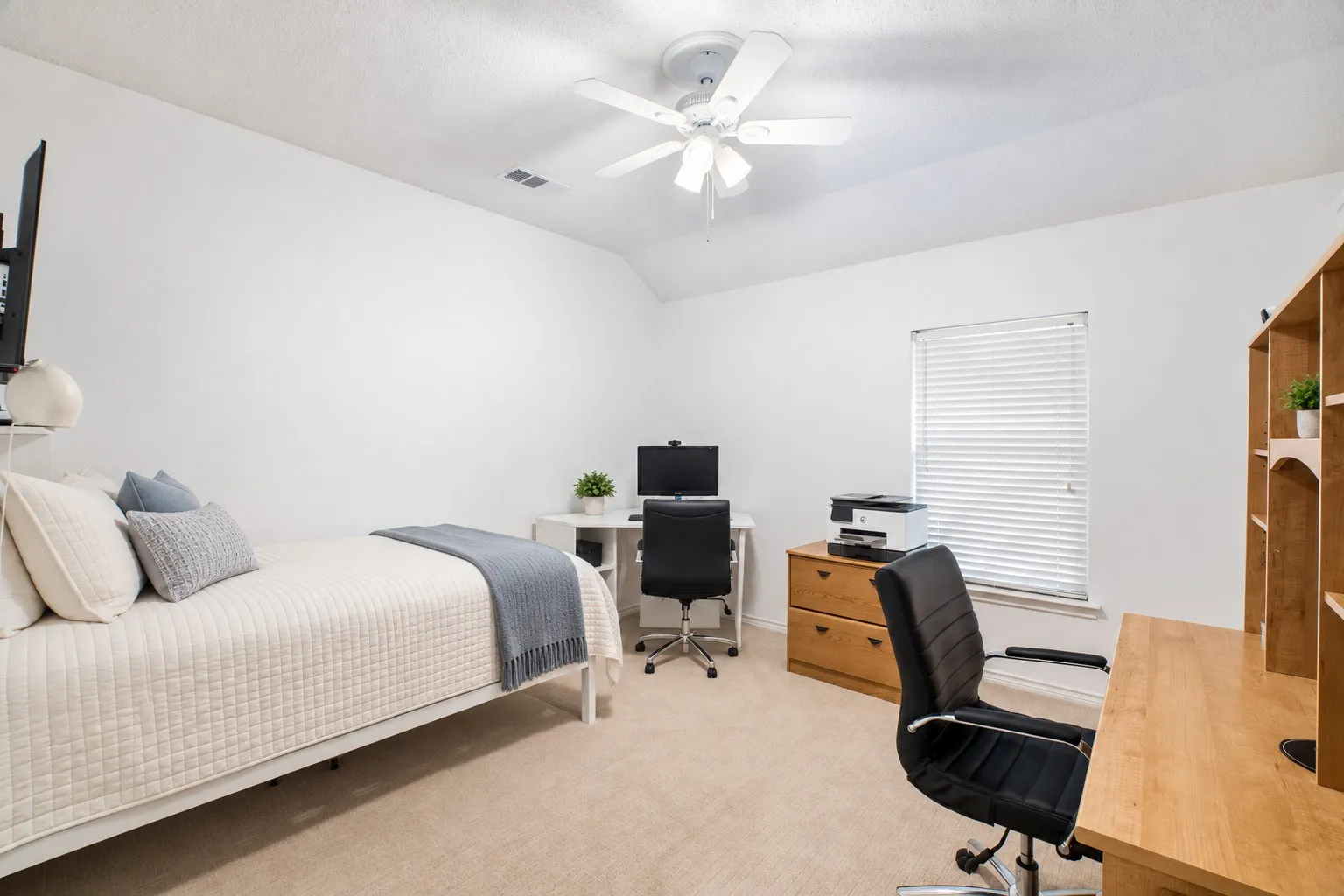 Bedroom 4 Carpeted room with a ceiling fan, a window with blinds, and built-in shelving