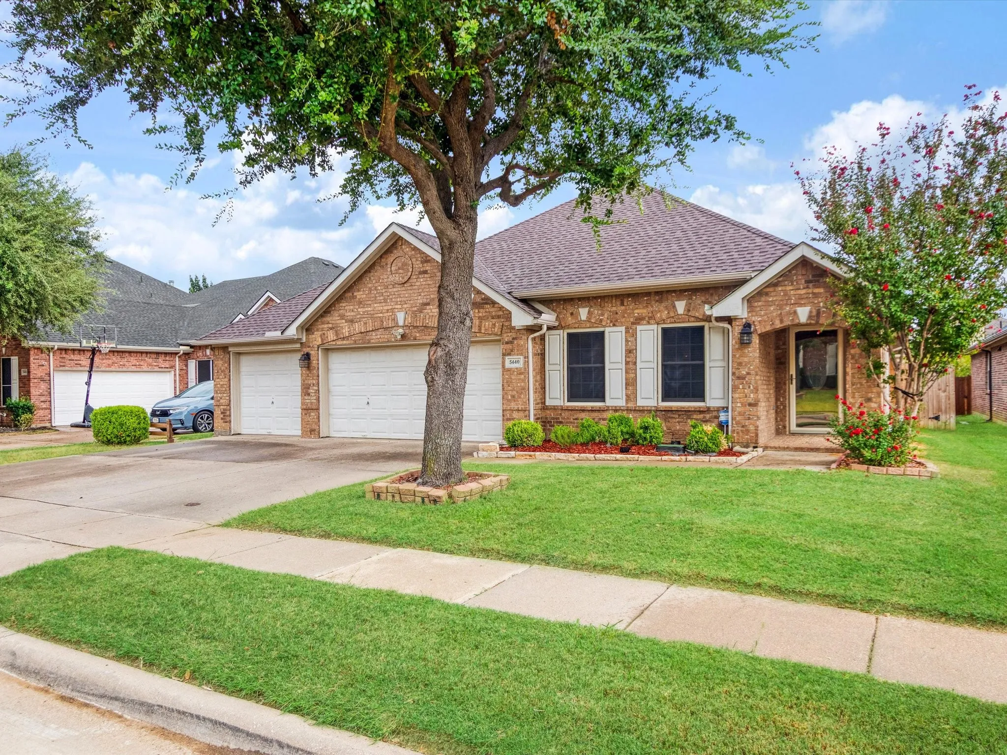 Brick exterior with a two-car garage