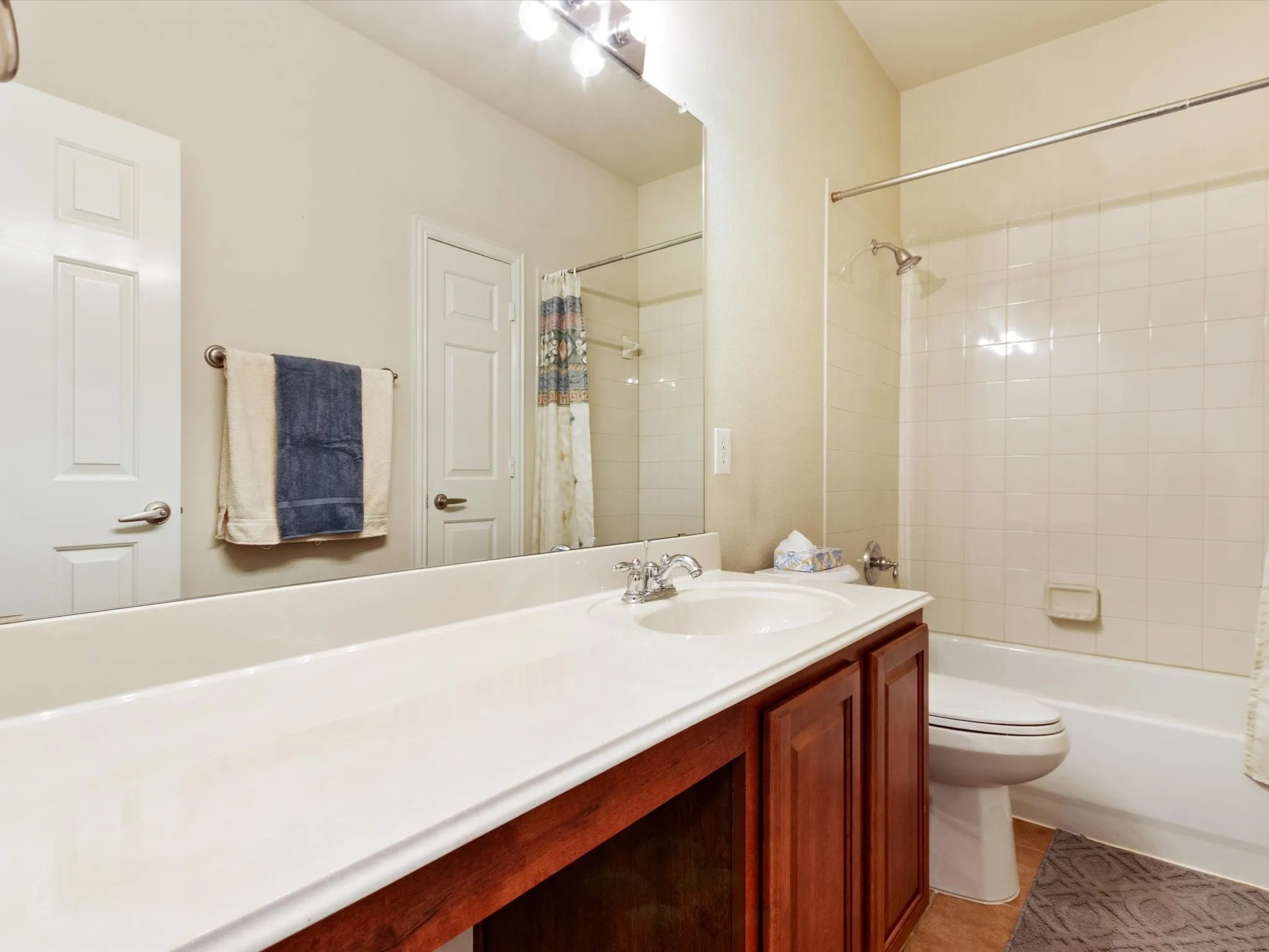 Full vanity mirror with overhead lighting