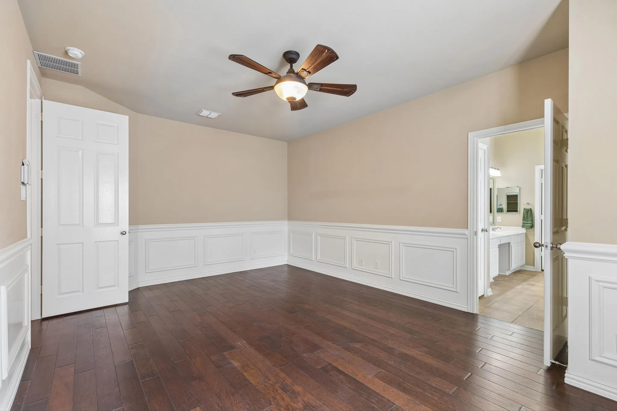 Wood-finish flooring, wainscoting, ceiling fan