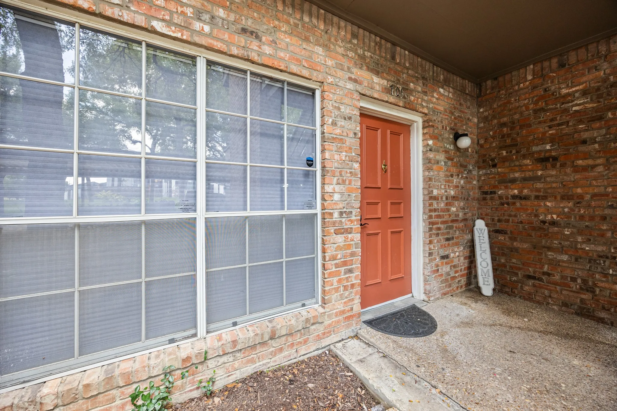 Brick exterior with a covered entry
