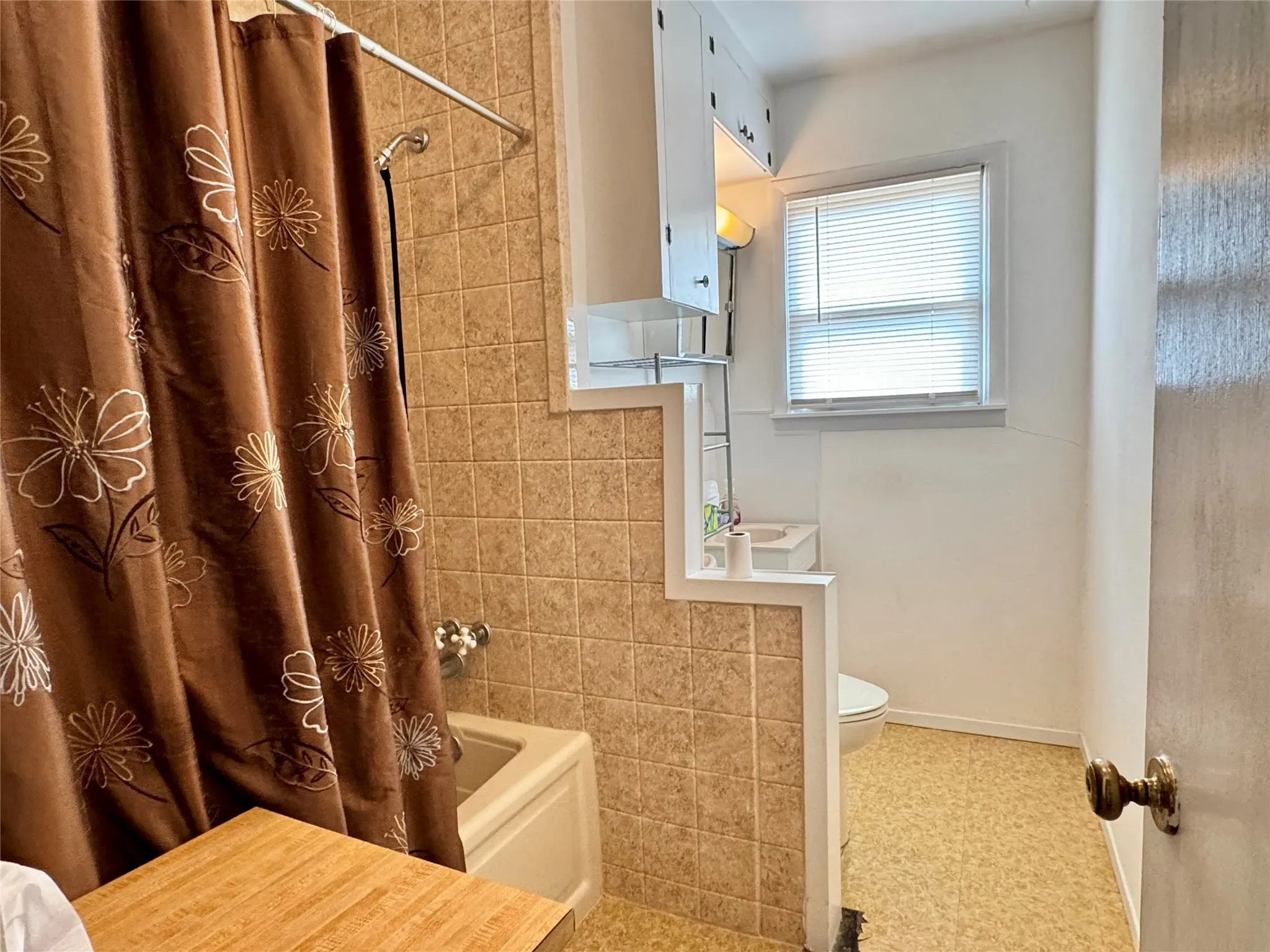 Hall bathroom with a tub and shower