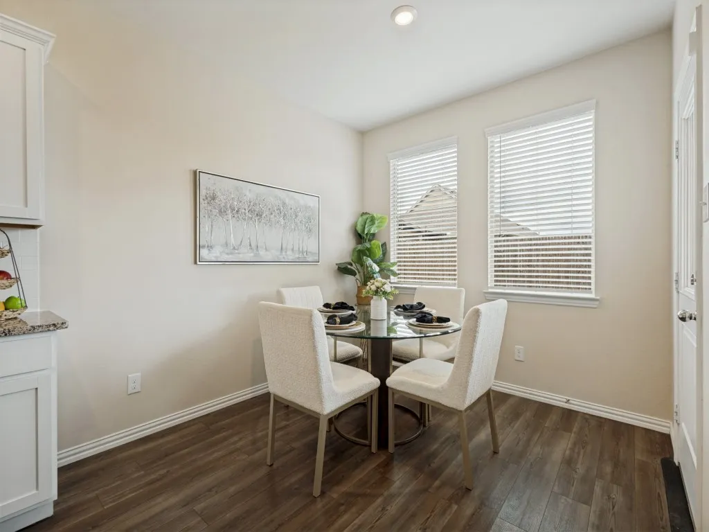 Plenty of space for a dining table the overlooks the backyard and enlarged back patio!