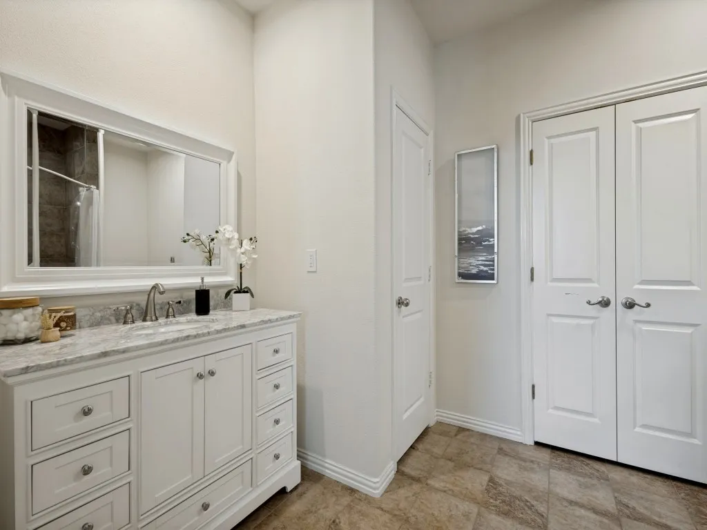 The primary bathroom is a must see! Upgraded vanity with a linen closet and huge walk in closet.