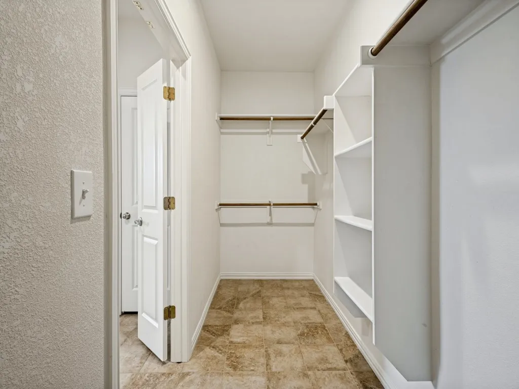 Large walk in primary closet.