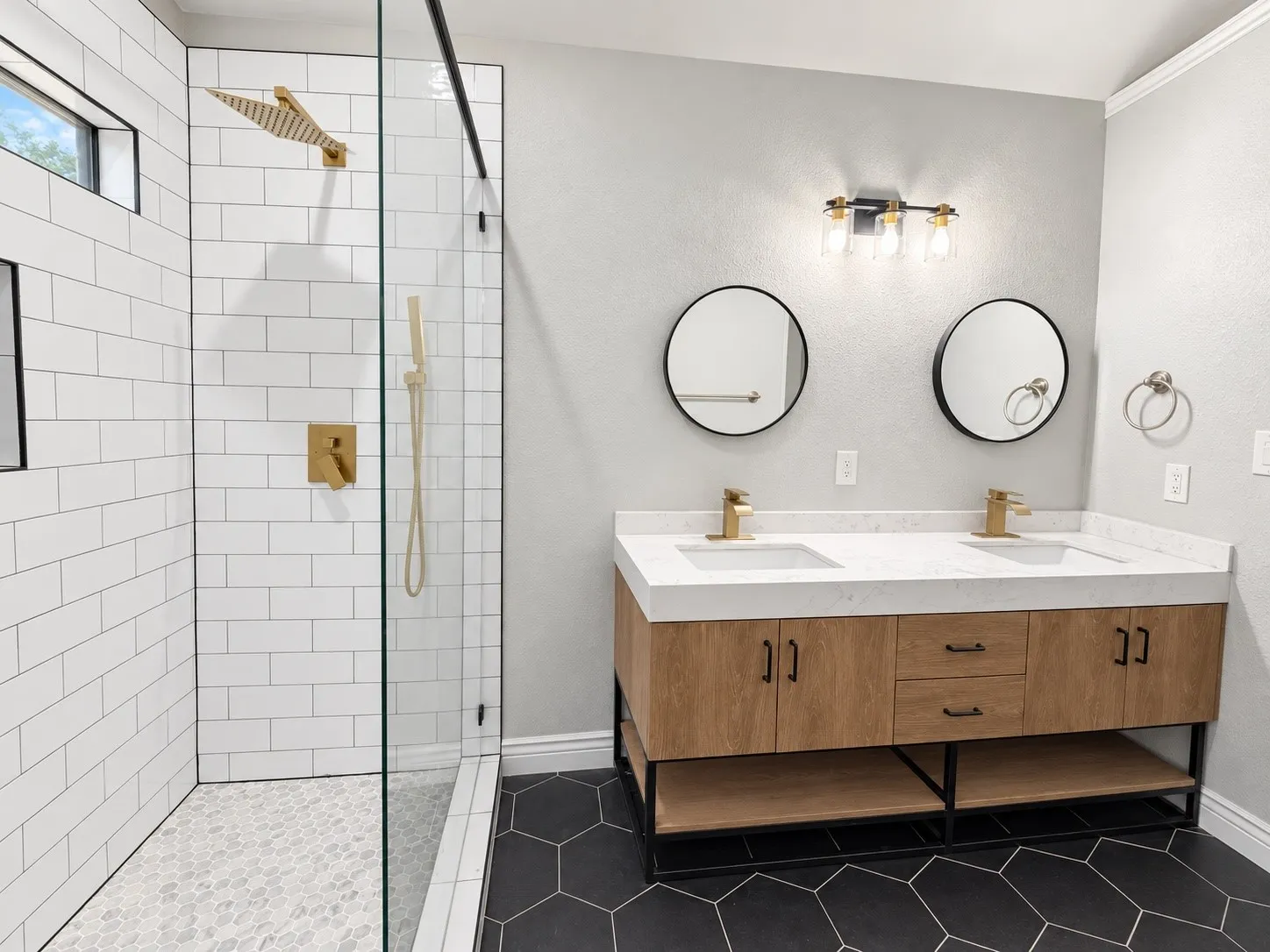 Dual vanity with wood-finish cabinetry and white countertops