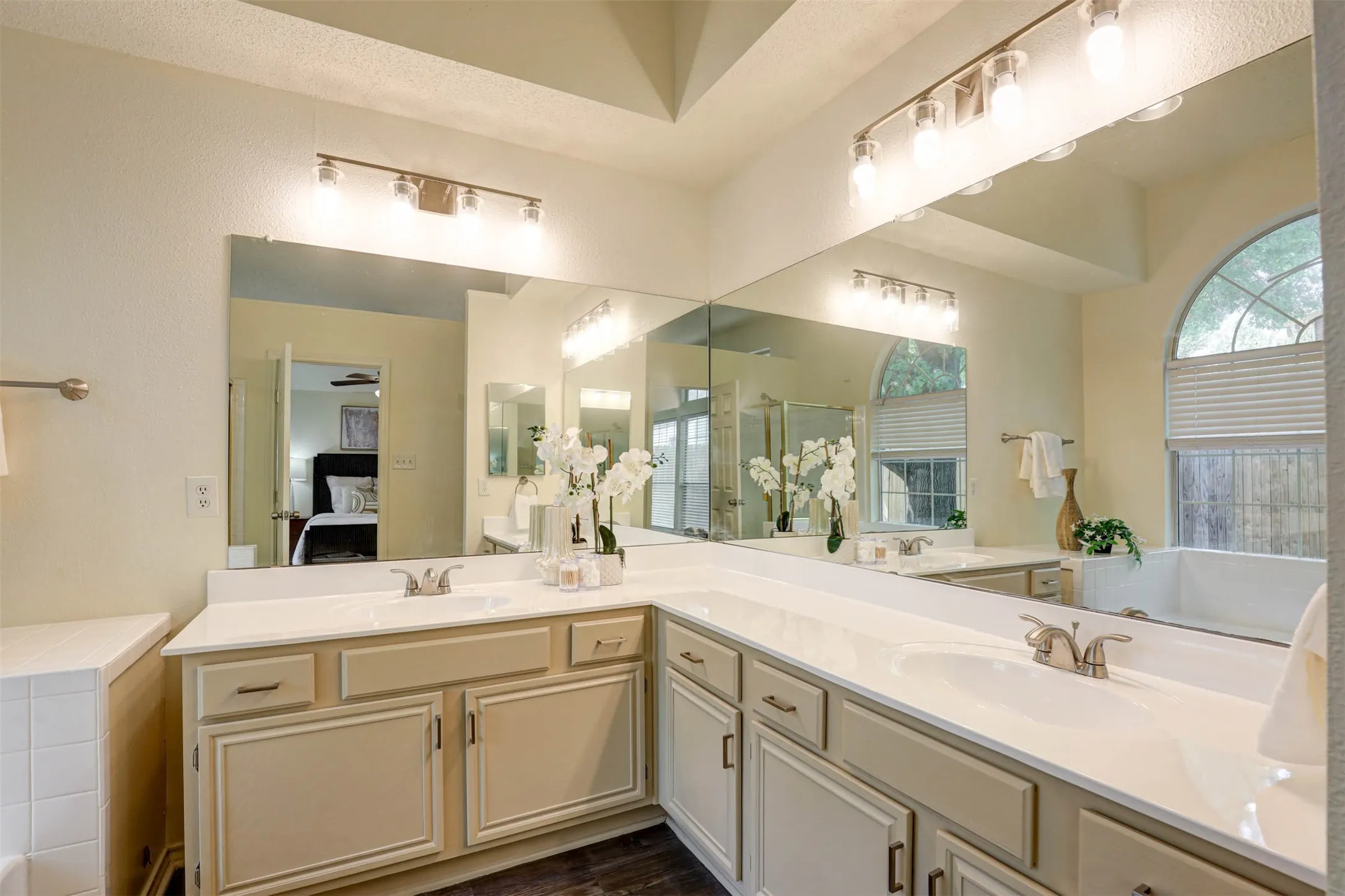 WOW! Beautiful master bathroom. Lots of counter space and double sinks. Refinished cabinets and counters, brushed nickel faucets, and plenty of storage.