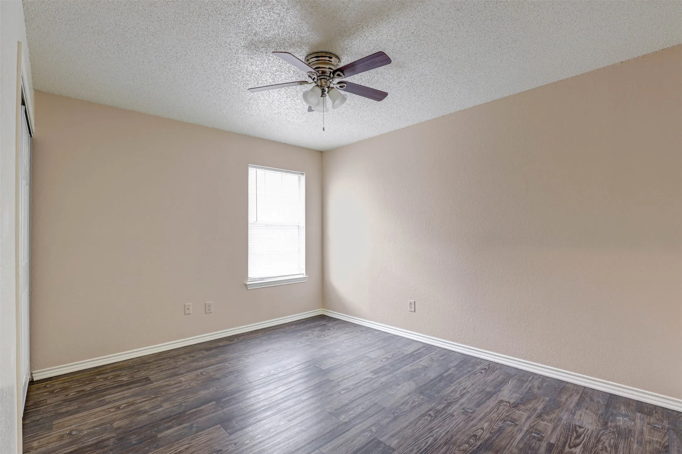Bedroom 2-A welcoming bedroom with a ceiling fan and ample space to personalize for work, rest, or play.