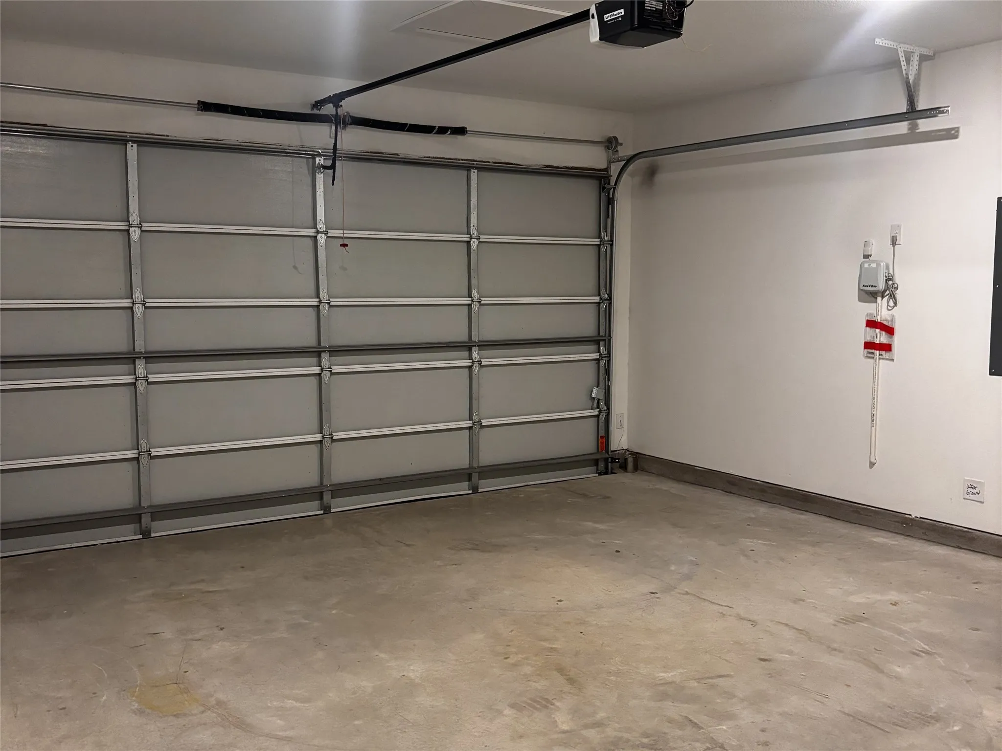 Interior garage space with a concrete floor