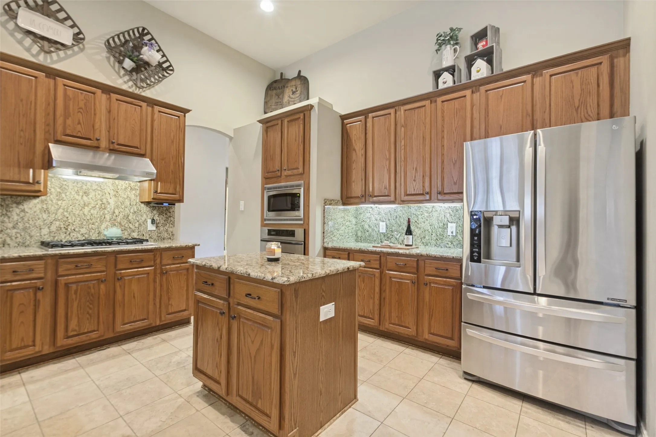 Kitchen with a gas cooktop, plenty of counter space and an island with cabinets