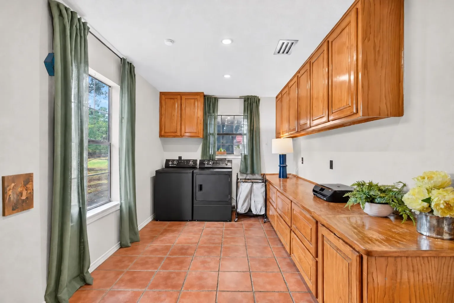 Laundry room is HUGE with tons of storage and great natural light.