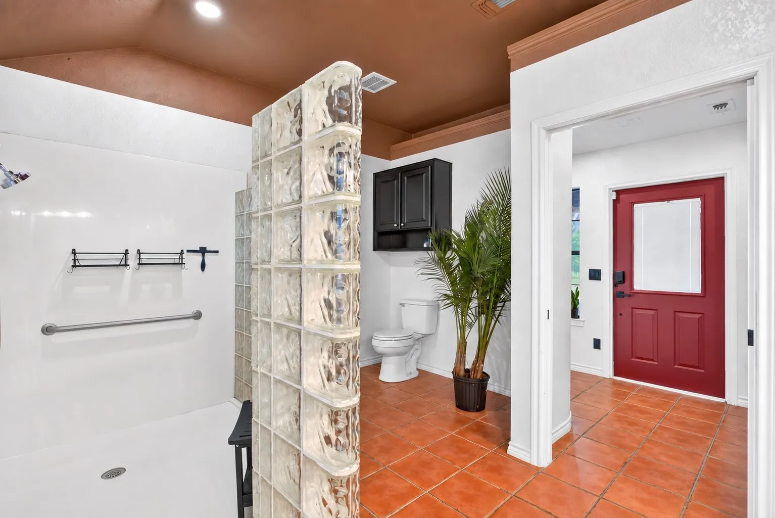 Generous block-tile walk-in shower.