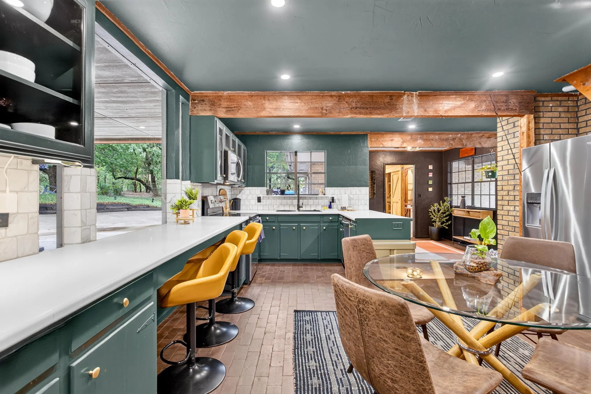 Another look at this now expansive space; views to the entryway foyer, pantry beyond and hallway to secondary bedrooms.