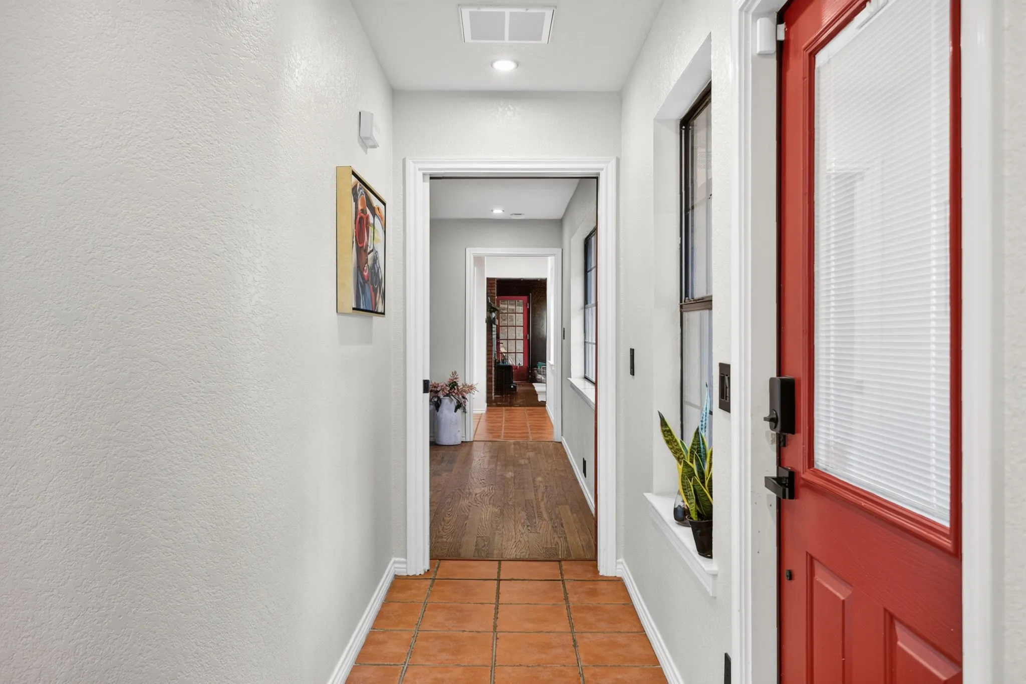 Hallway to the primary suite area.