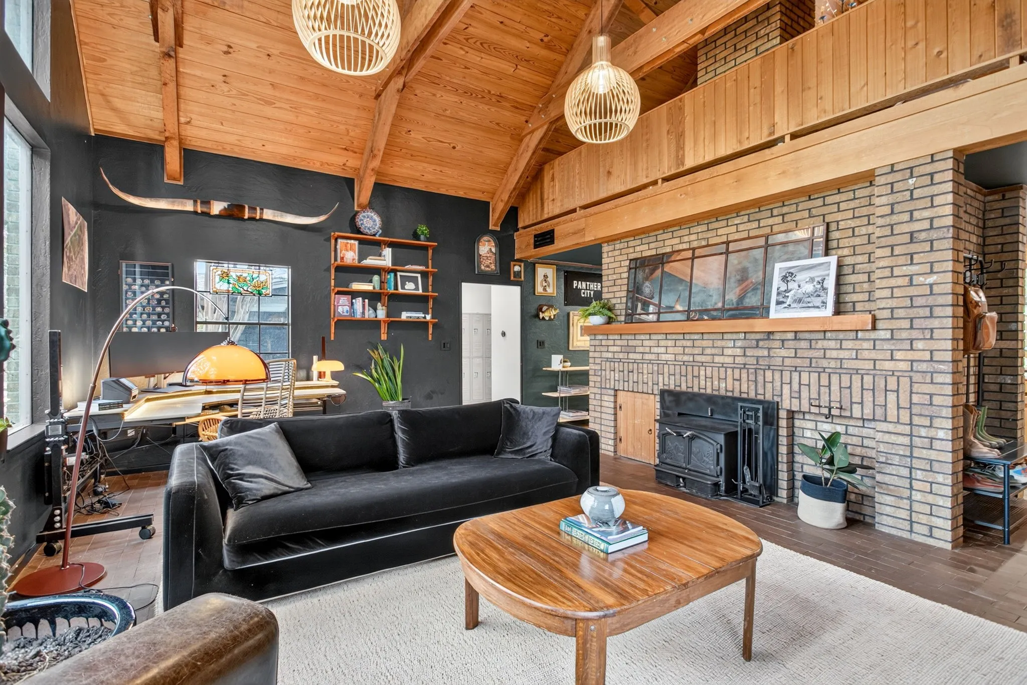 The handsome wood pellet fireplace takes center stage - the mantel ready for your statement piece.