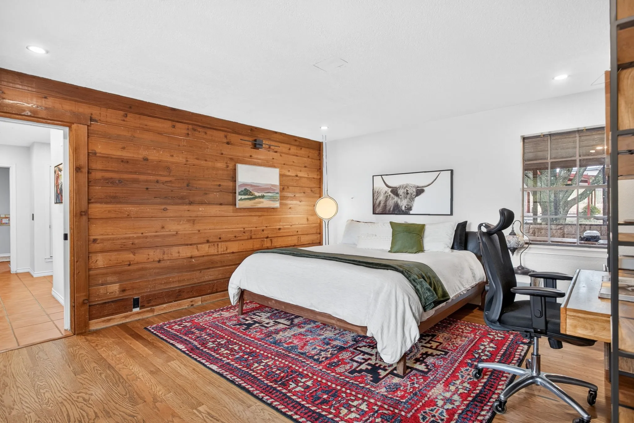 Just a gorgeous, peaceful primary suite with more fabulous shiplap, wood floors, and great views everywhere you look.