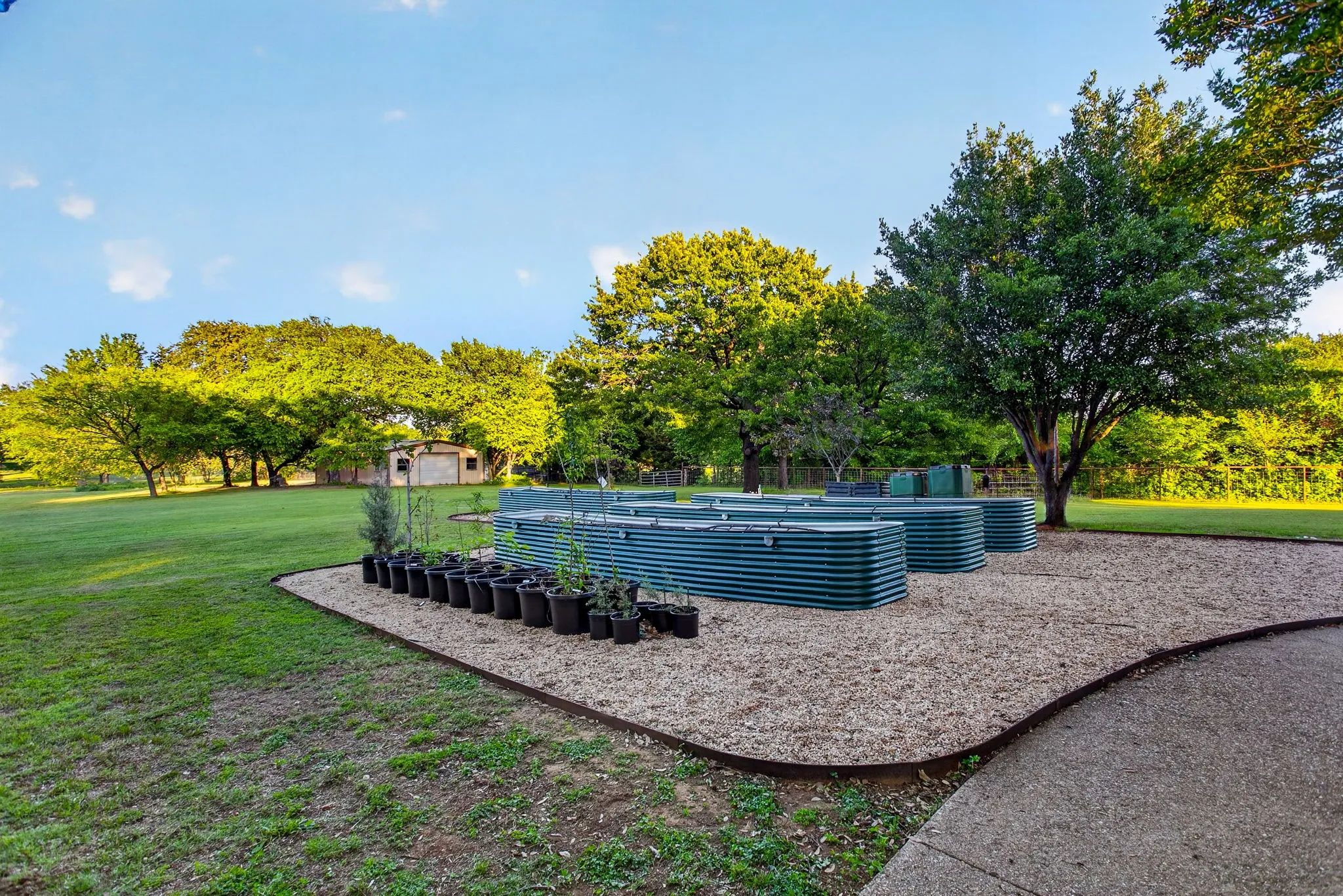 Raised, irrigated garden beds with fill and grid tops. Graveled garden area. Amazing!
