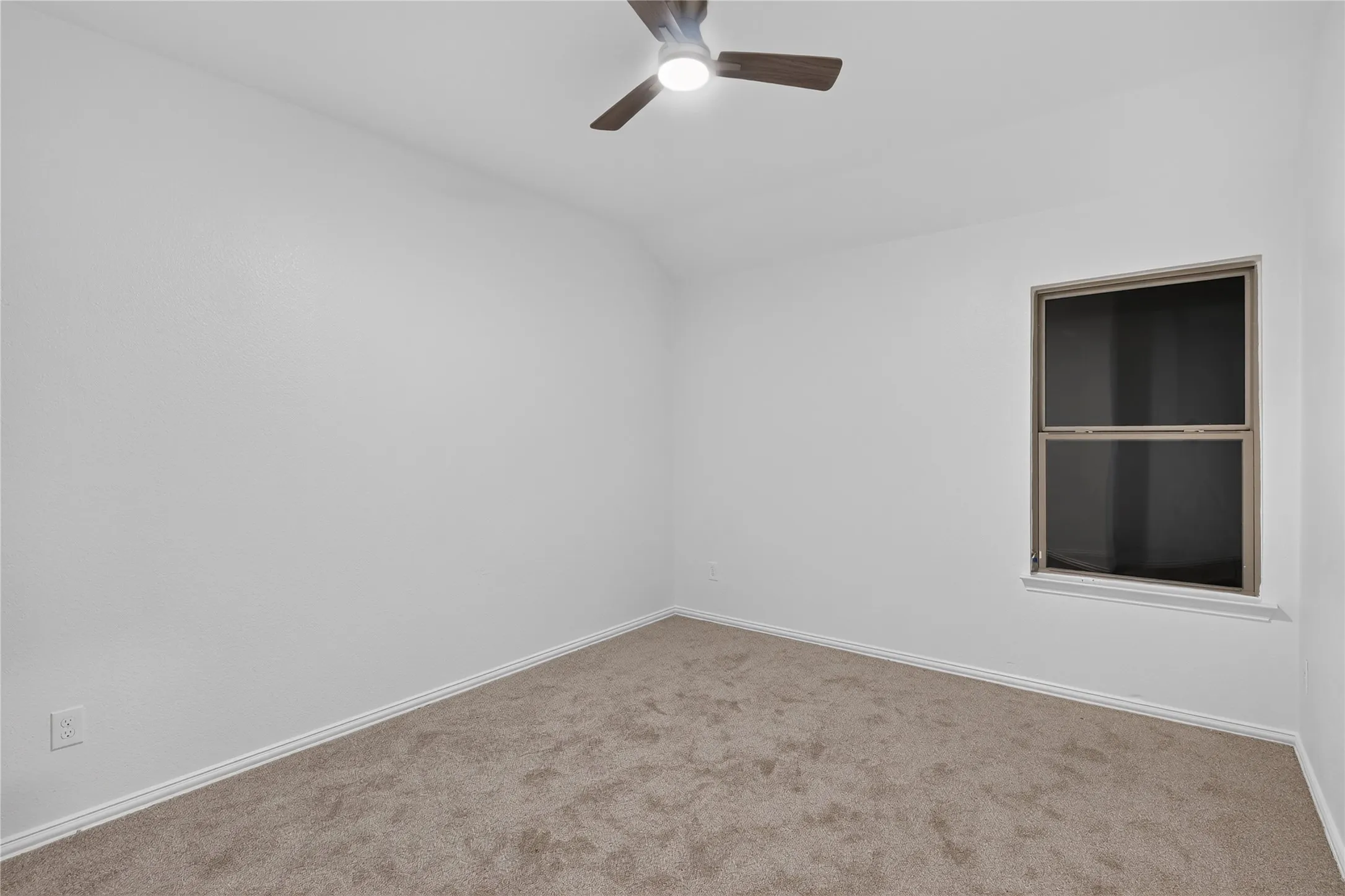 Recessed lighting, wood-finish ceiling fan, window with trim, neutral wall color, and carpeted flooring