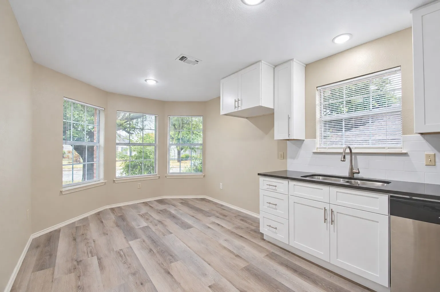 Kitchen with breakfast nook with tons of natural light