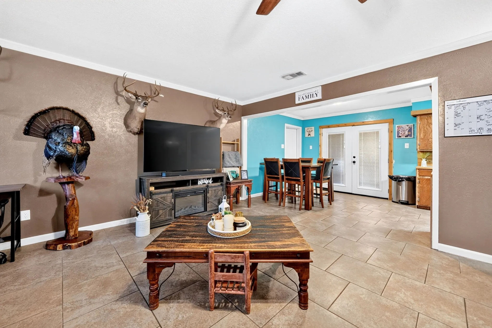 Tiled flooring throughout, recessed lighting, and a broad entryway to an adjoining space
