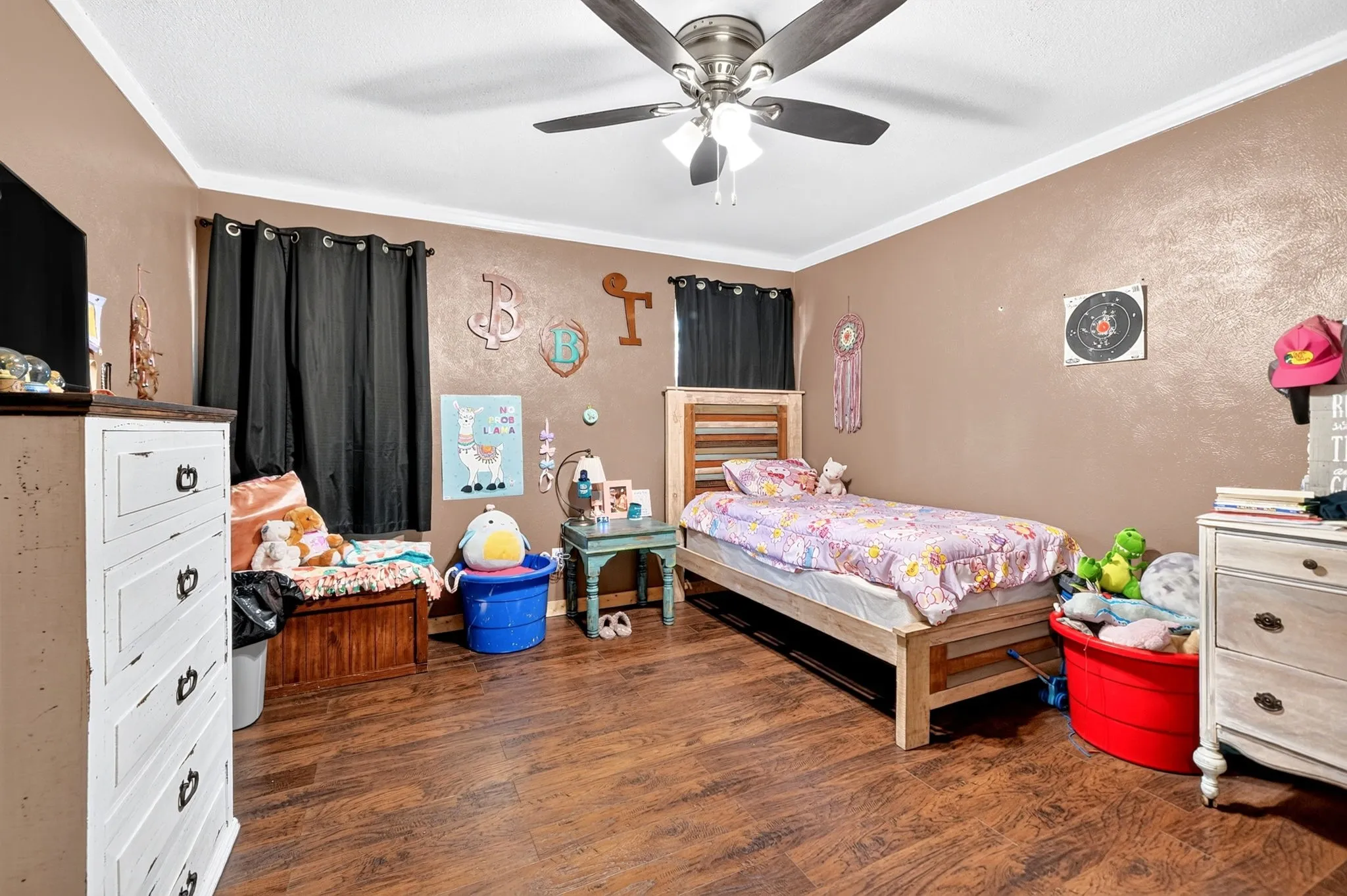 Wood-finish flooring with a ceiling fan light fixture