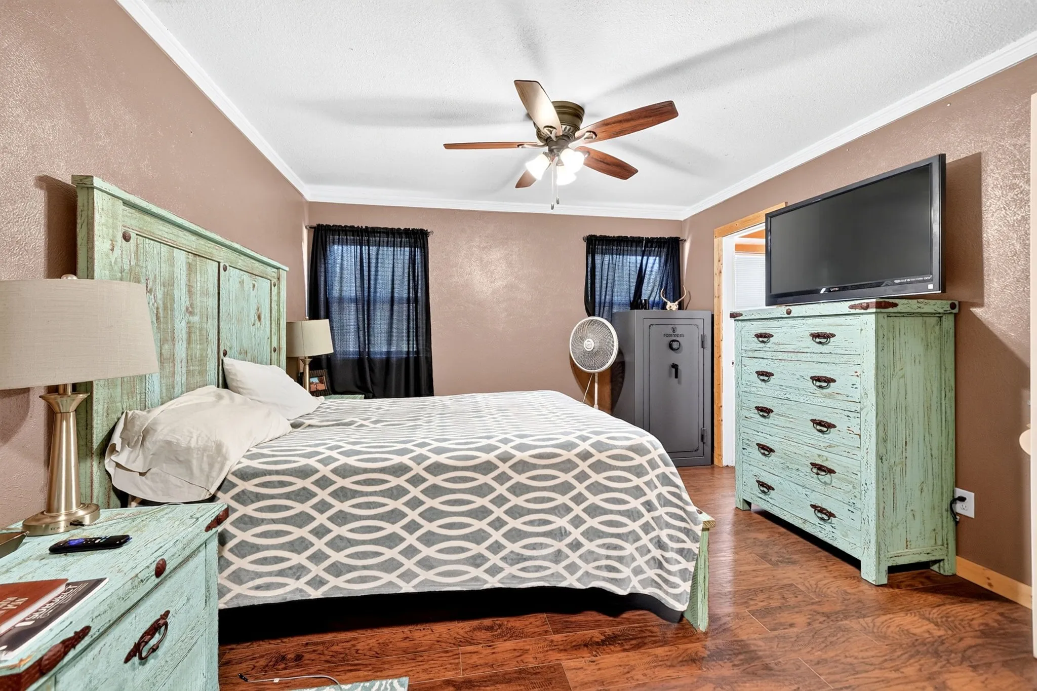 Warm-toned walls complement the wood-finish flooring