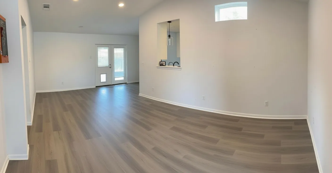 Spacious interior featuring wood-finish flooring, recessed lighting, and a pass-through window
