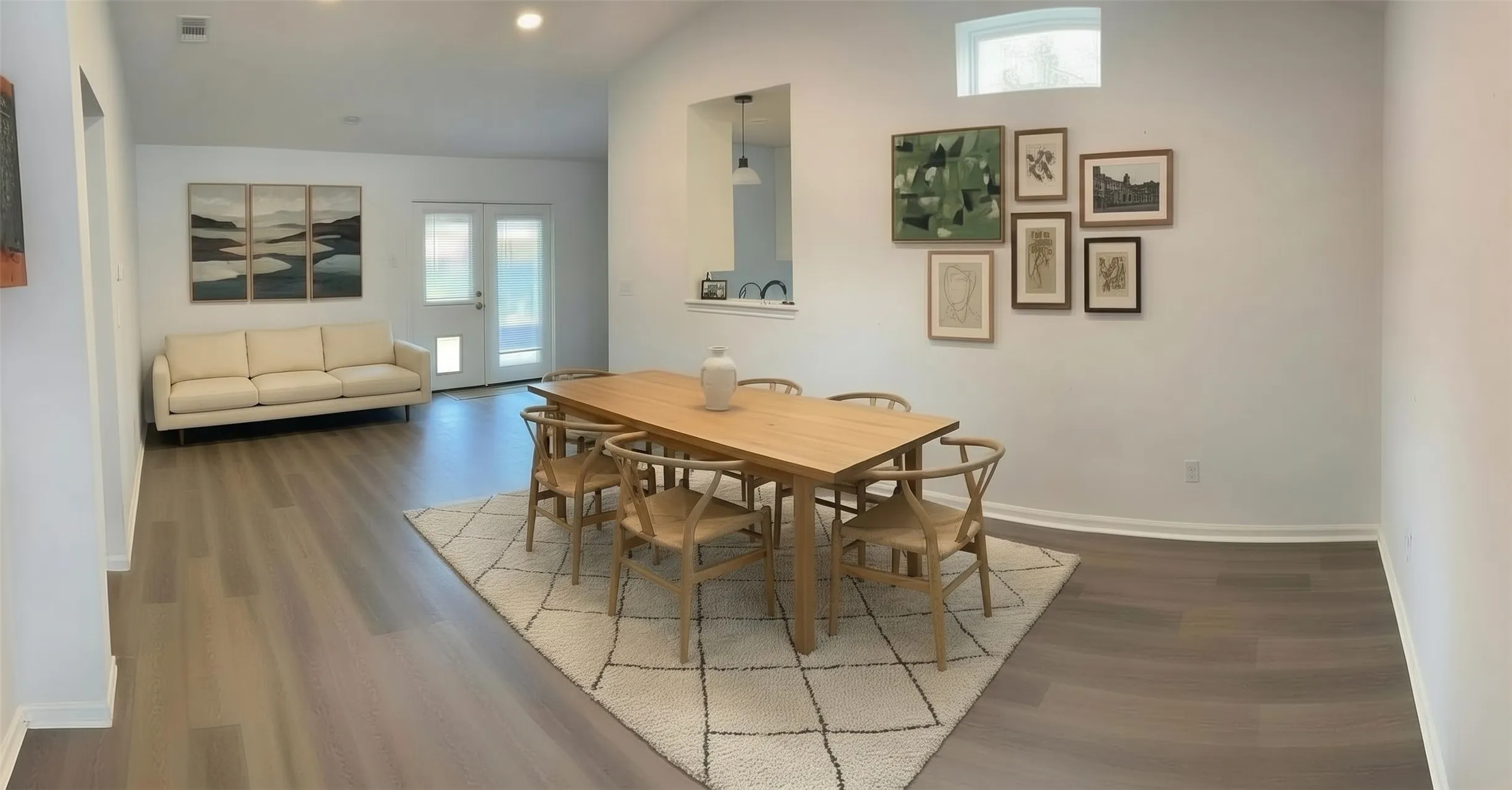 Vaulted ceilings, recessed lighting, double glass doors with transom window, and wood-finish flooring