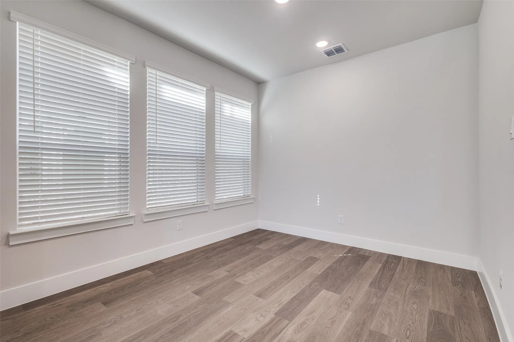 Empty room featuring light hardwood / wood-style floors