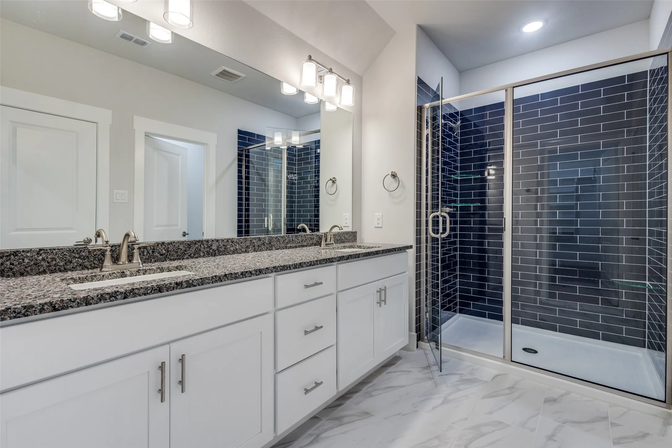 Bathroom featuring vanity and walk in shower