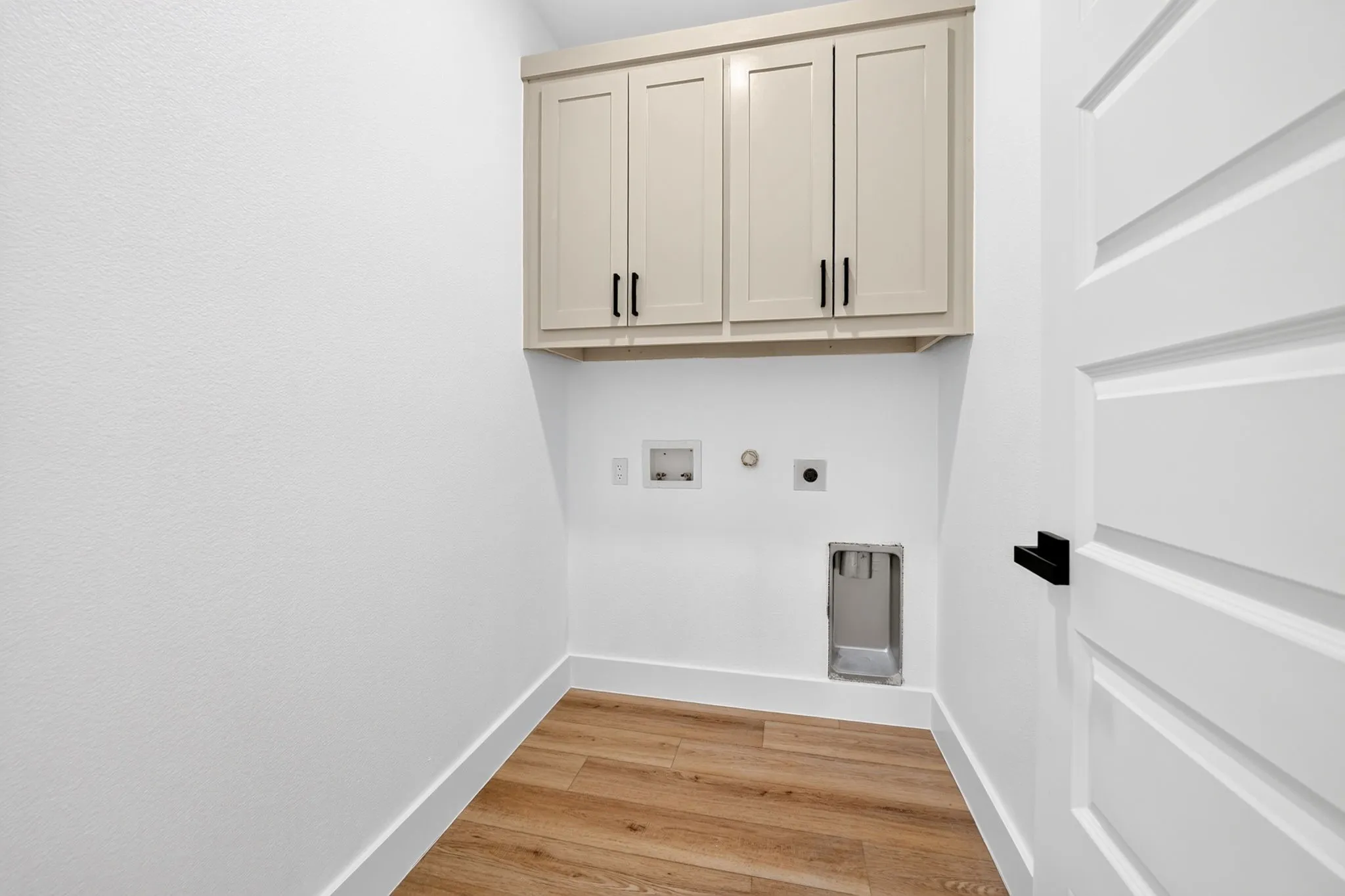 Upper cabinetry with matte black hardware