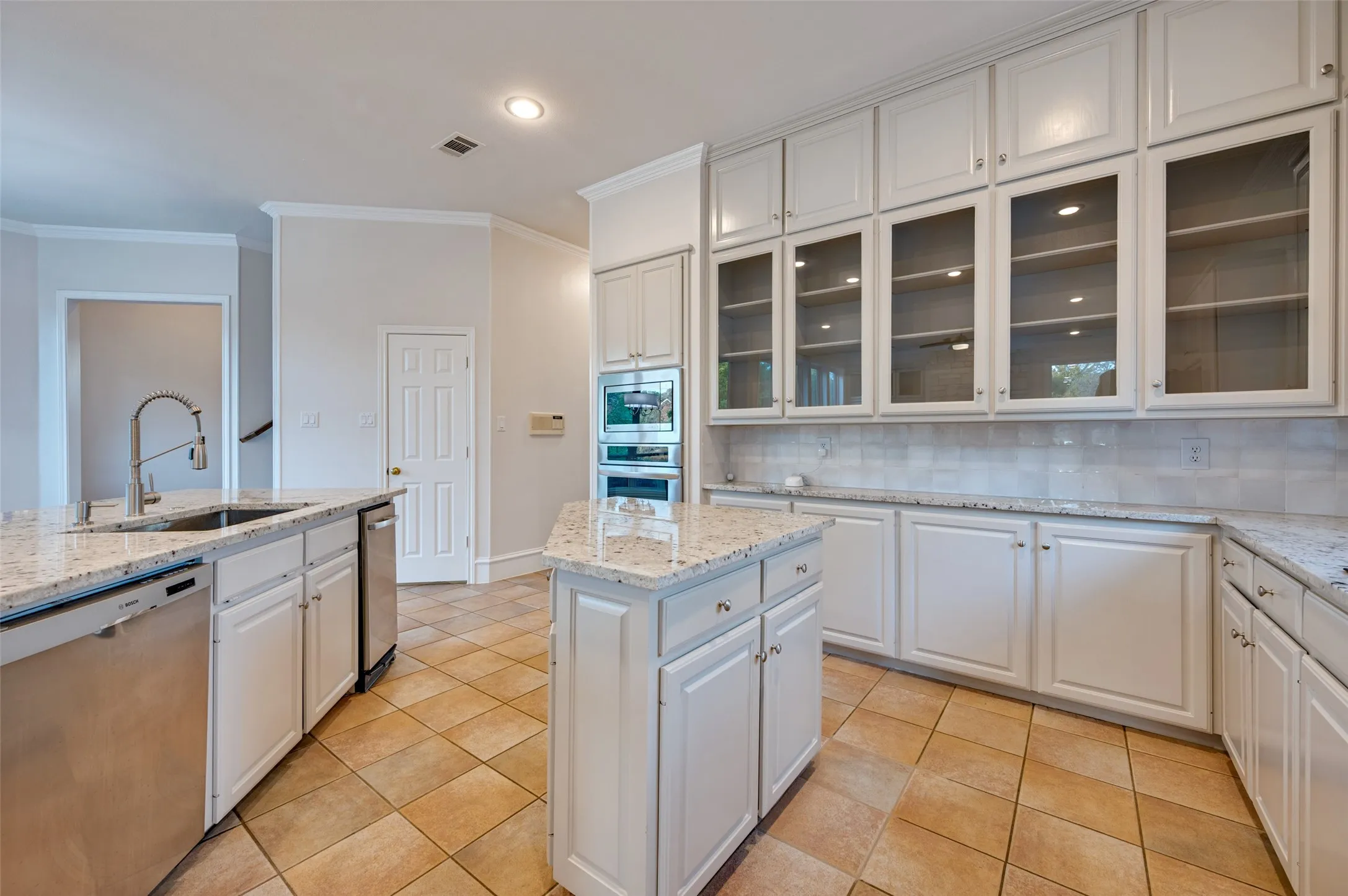 All new granite installed in Colonial White, newly painted cabinetry, & new kitchen sink and faucet